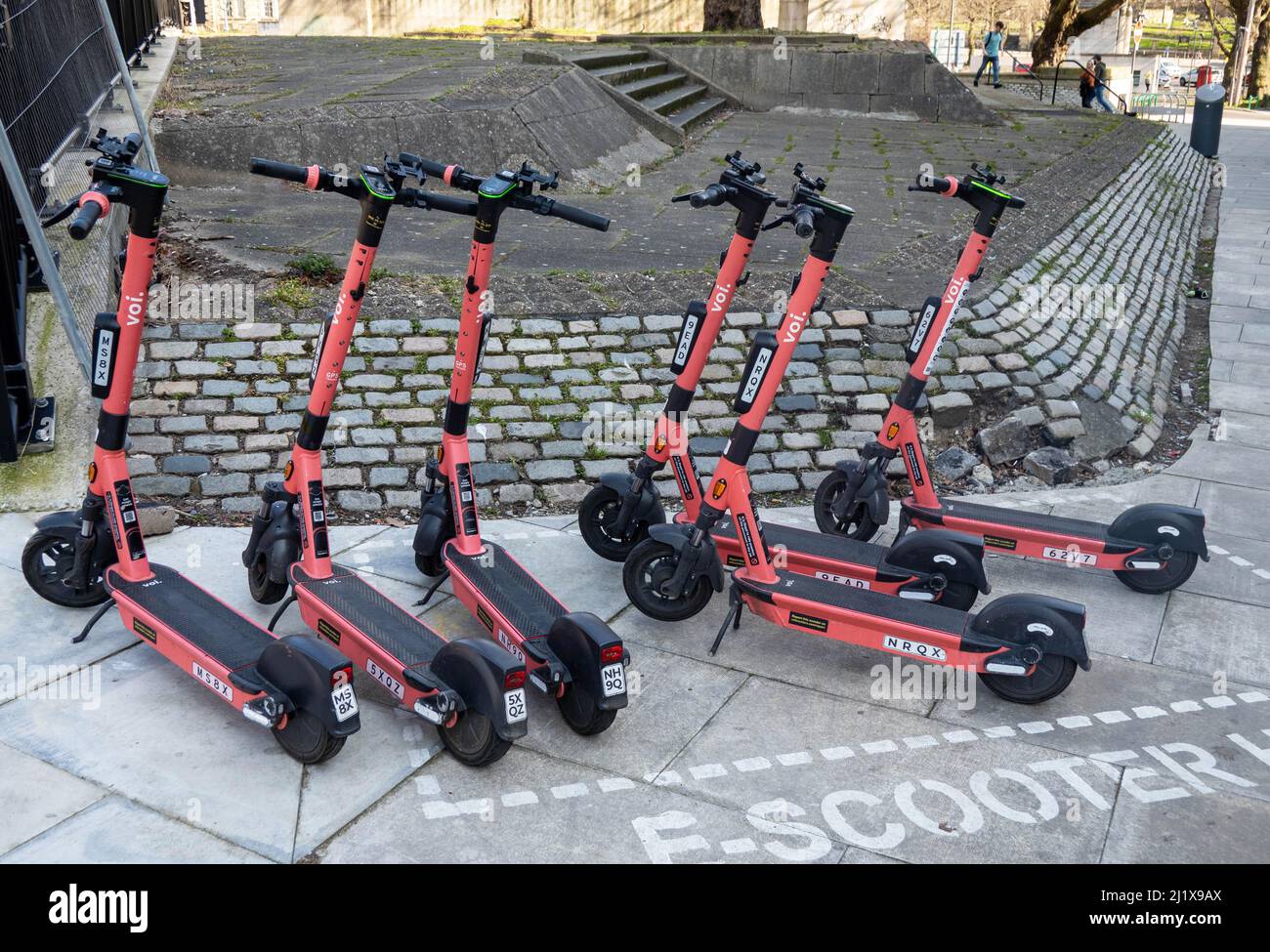 Six Voi e-scooters for rent in at a Liverpool hub Stock Photo