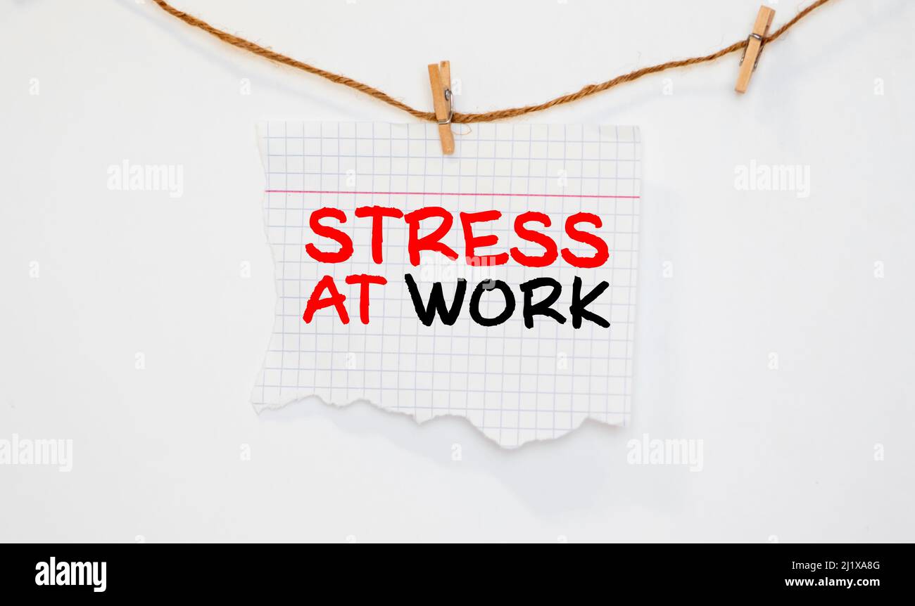 Concept conceptual mental stress at workplace or job abstract word cloud in hand isolated on background metaphor to health. Stock Photo