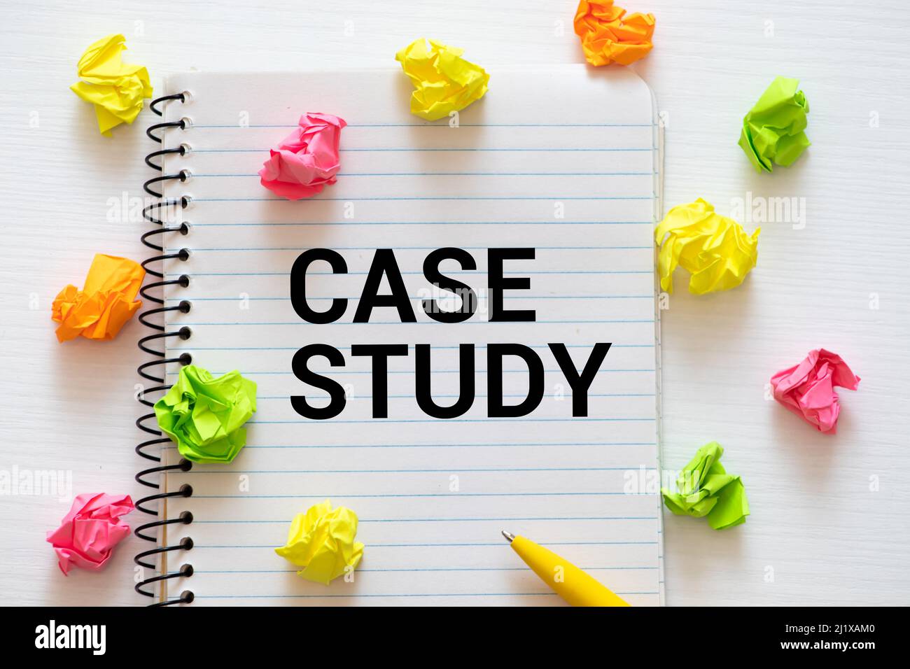 Case study memo written on a notebook with pen. Stock Photo