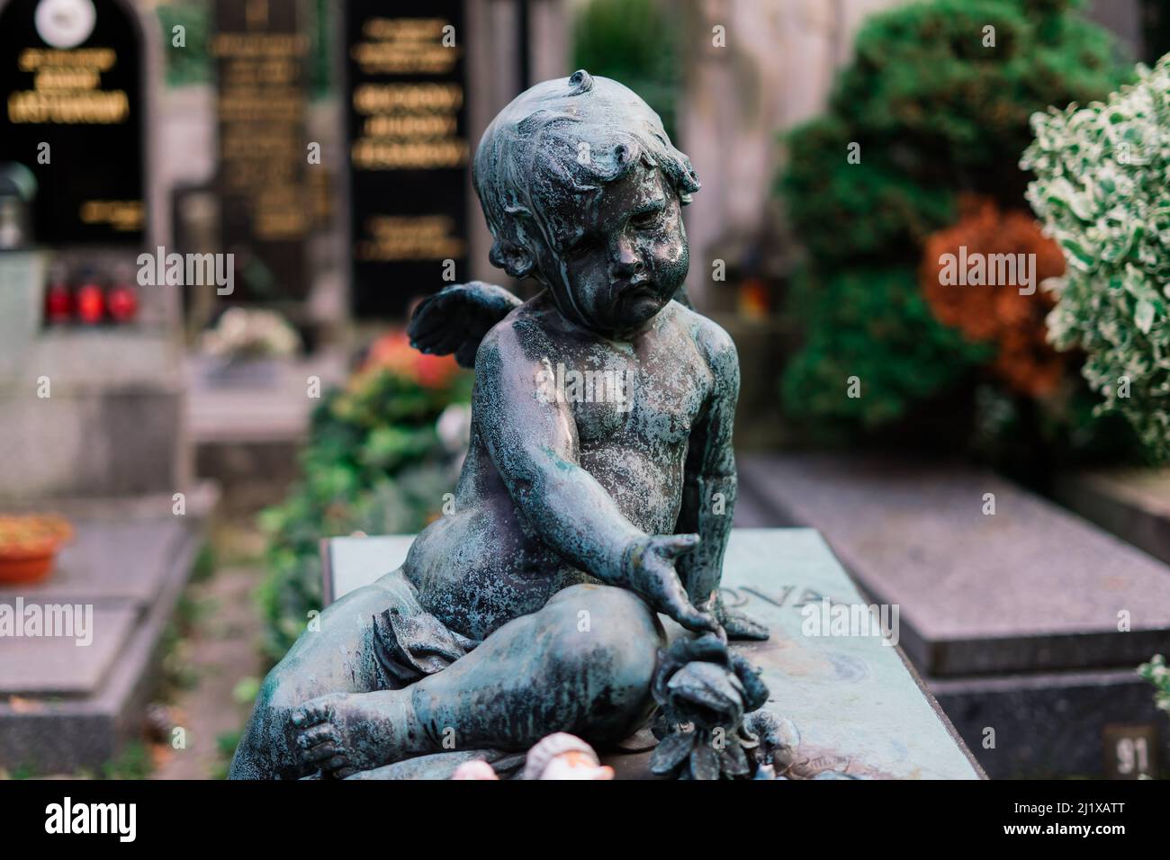 Cemetery statues, a despairing woman statue, crosses, resting place ...