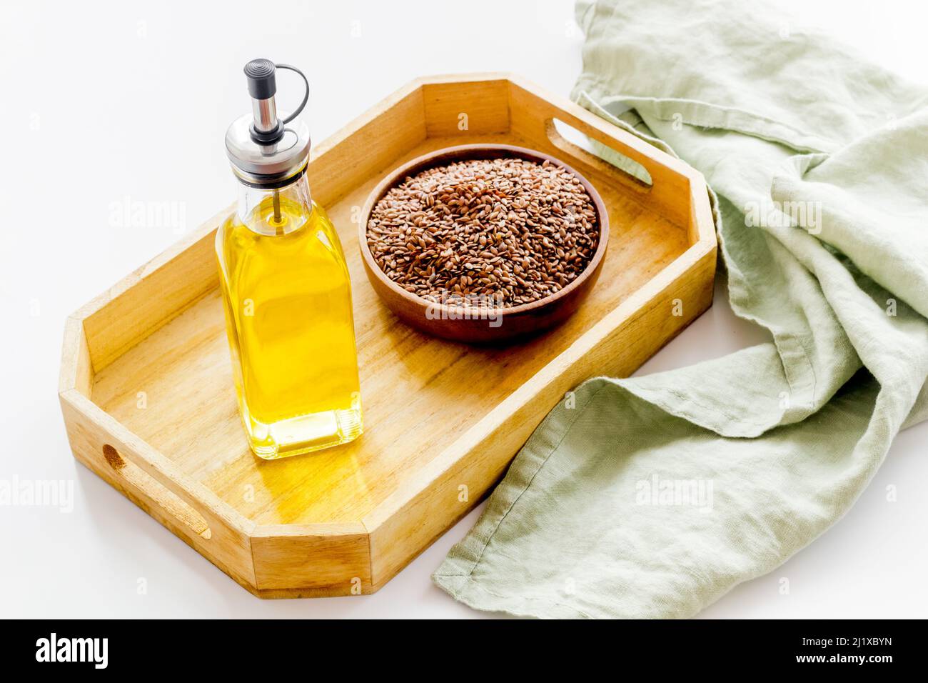 Bottle of sesame cooking oil with seeds in bowl Stock Photo Alamy
