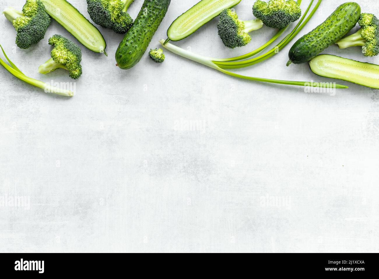 Flatlay of green vegetables broccoli and cucumber. Food background