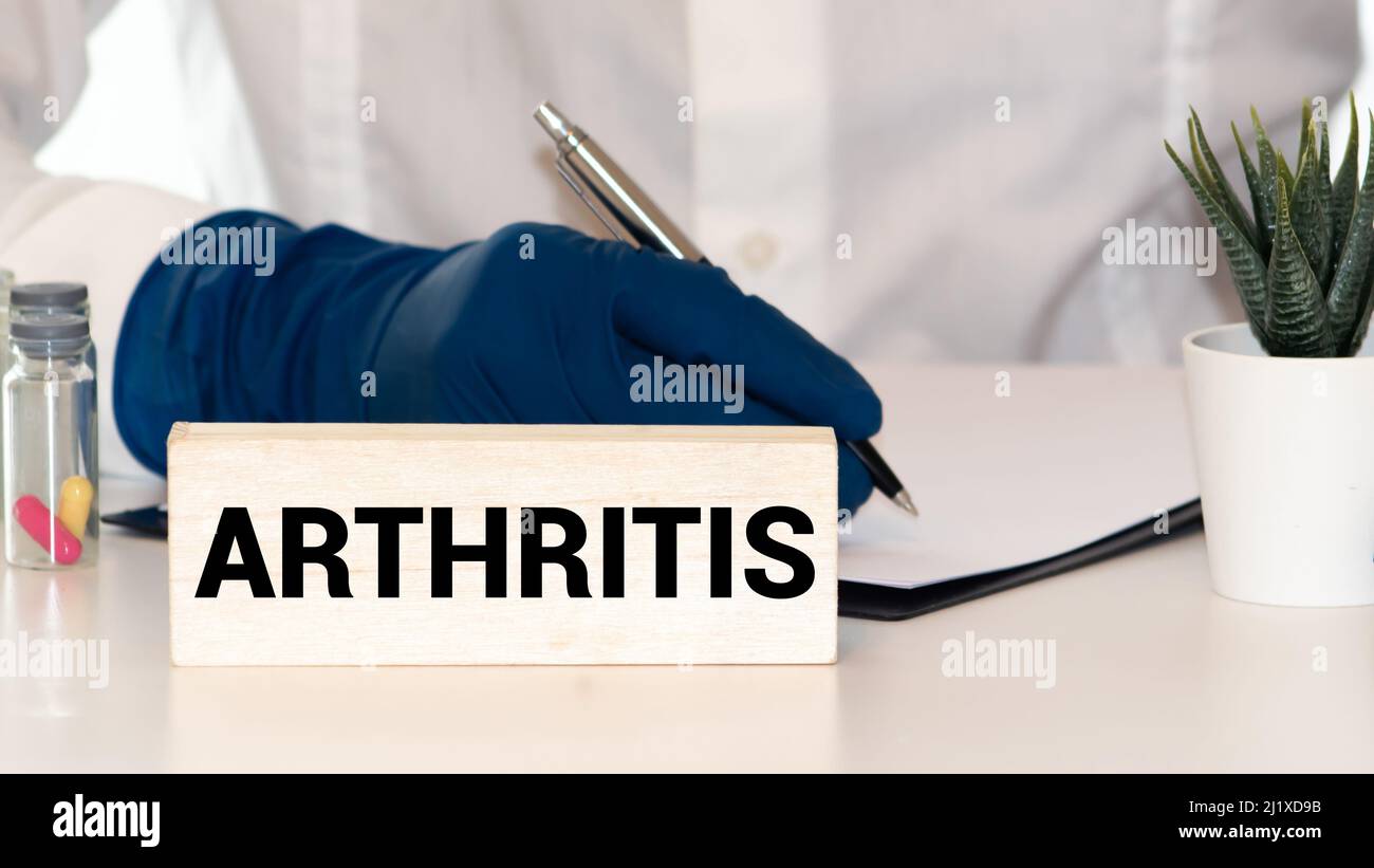 Arthritis Doctor with chalkboard on white background Stock Photo Alamy