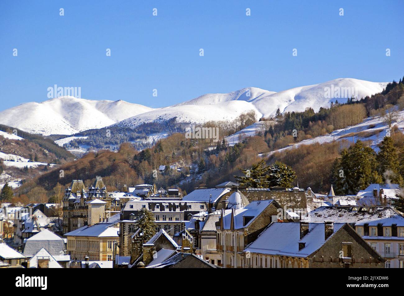 The town of La Bourboule with Puy de la Tache in the distance Stock Photo