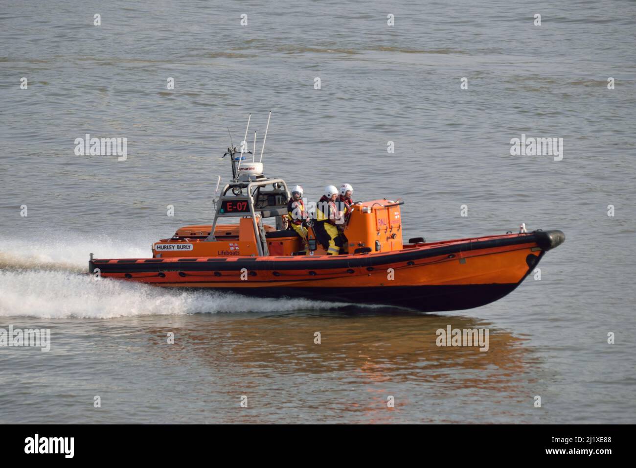 RNLI Lifeboat E-07, based at London's Tower Lifeboat station, seen heading back up the Thames at high speed whilst deploying to an incident Stock Photo