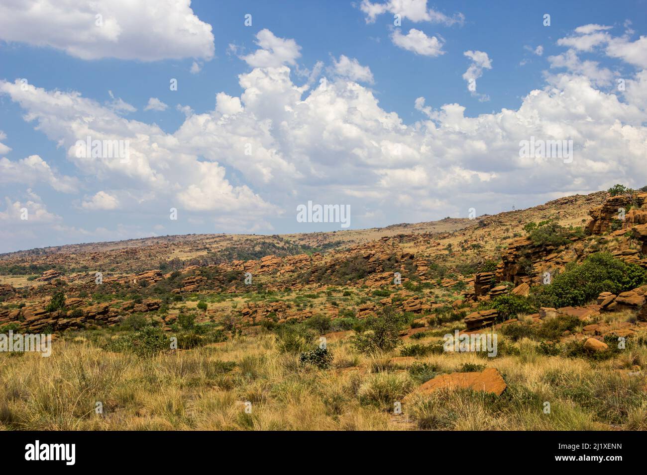 View over the rugged, boulder strewn landscape of the Magaliesberg Mountains Stock Photo