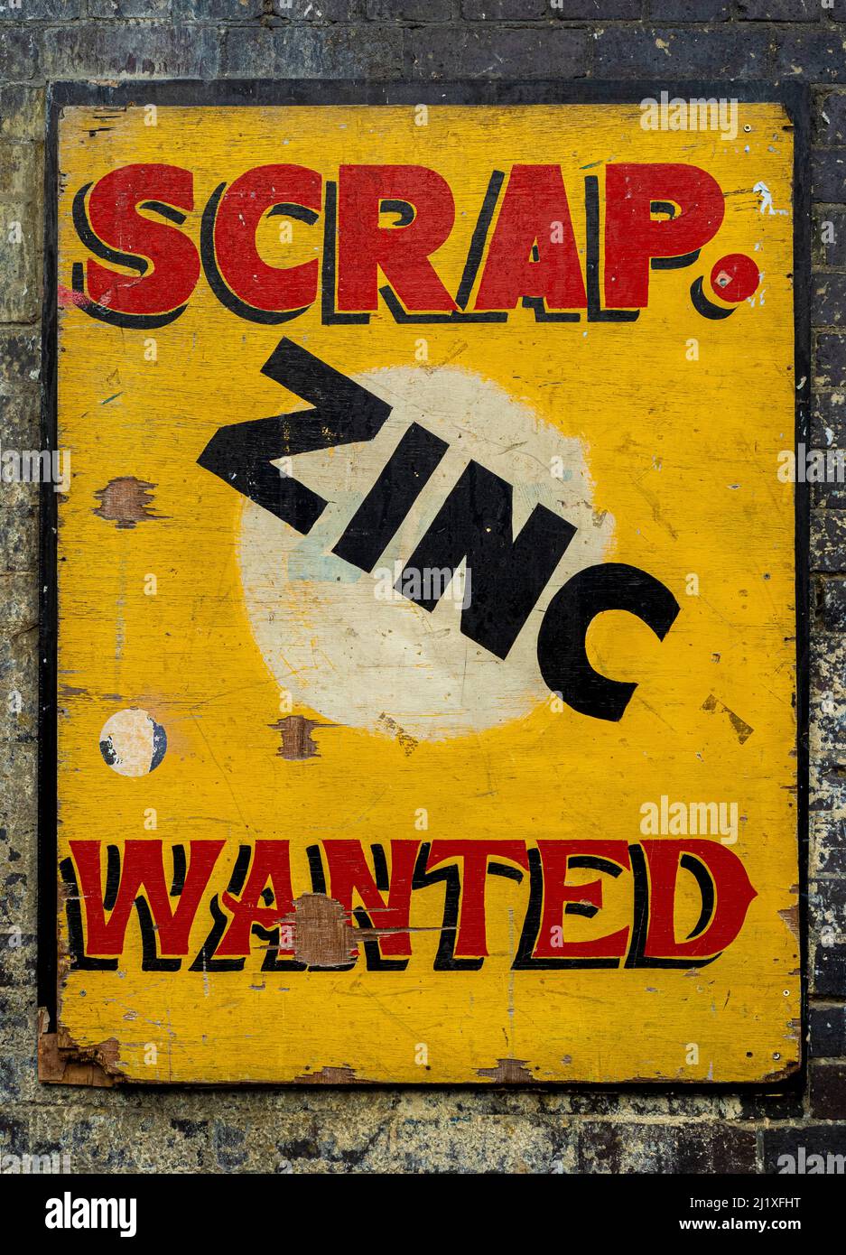 Vintage yellow scrap zinc wanted sign outside the Electrowerkz entertainment venue and restaurant in Torrens Street, London, UK Stock Photo