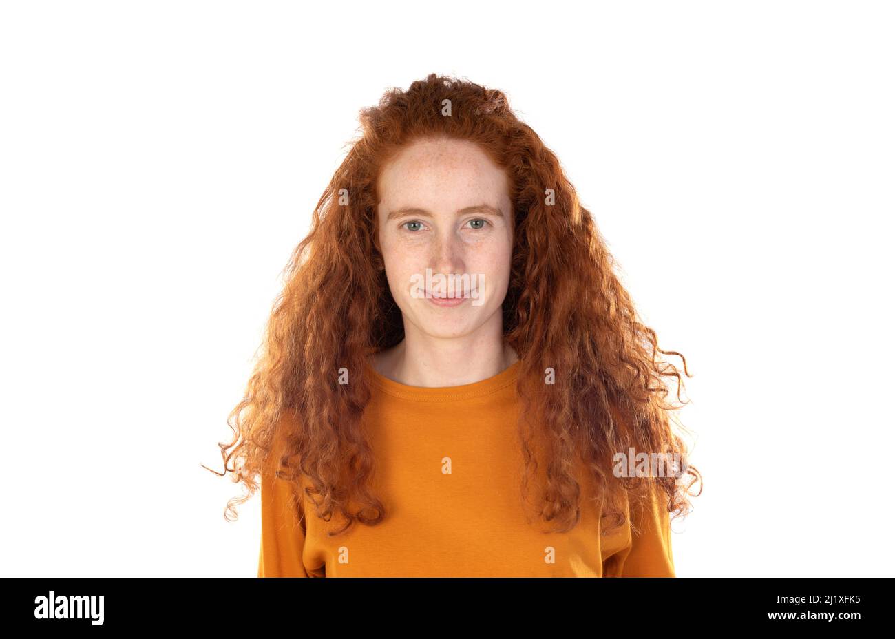 Redhaired younger woman with orange t-shirt isolated on a white background Stock Photo