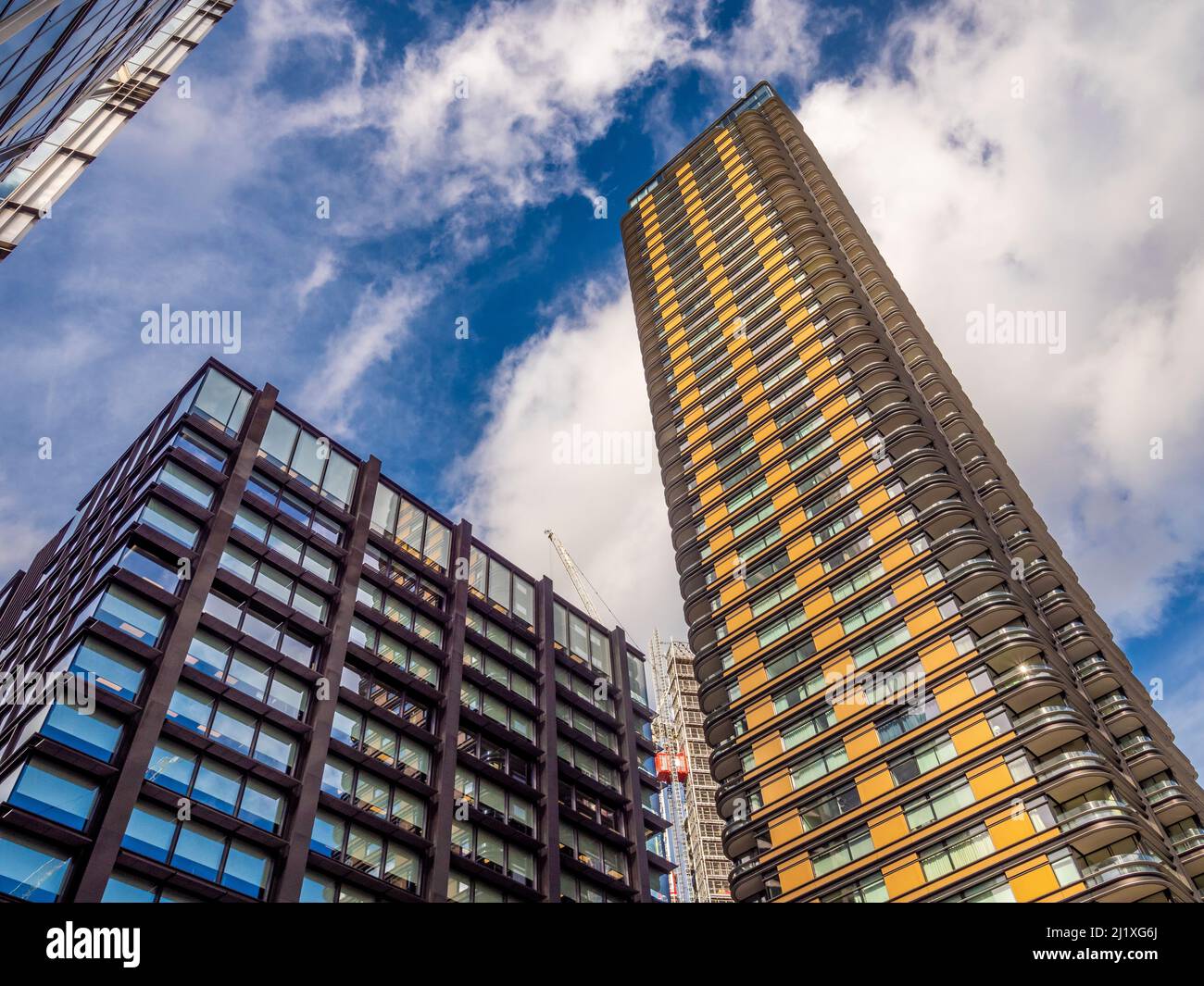 Principal Place and Principal Tower seen from ground level looking upwards towards a blue sky. London. Stock Photo