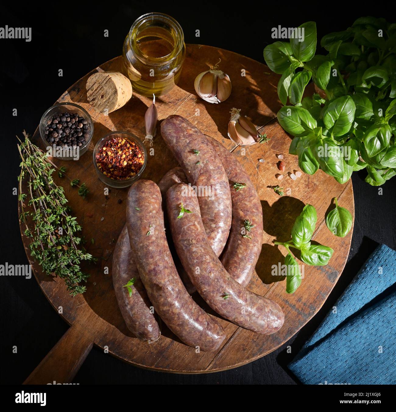 Uncooked Raw Beef And Pork Sausage Sausages and spices Stock Photo