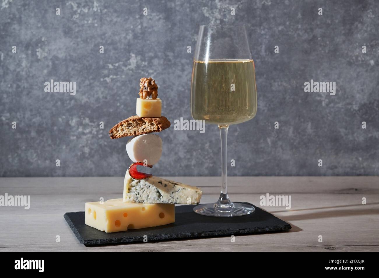 Concept Equilibrium Floating Food and White Wine Glass Stock Photo