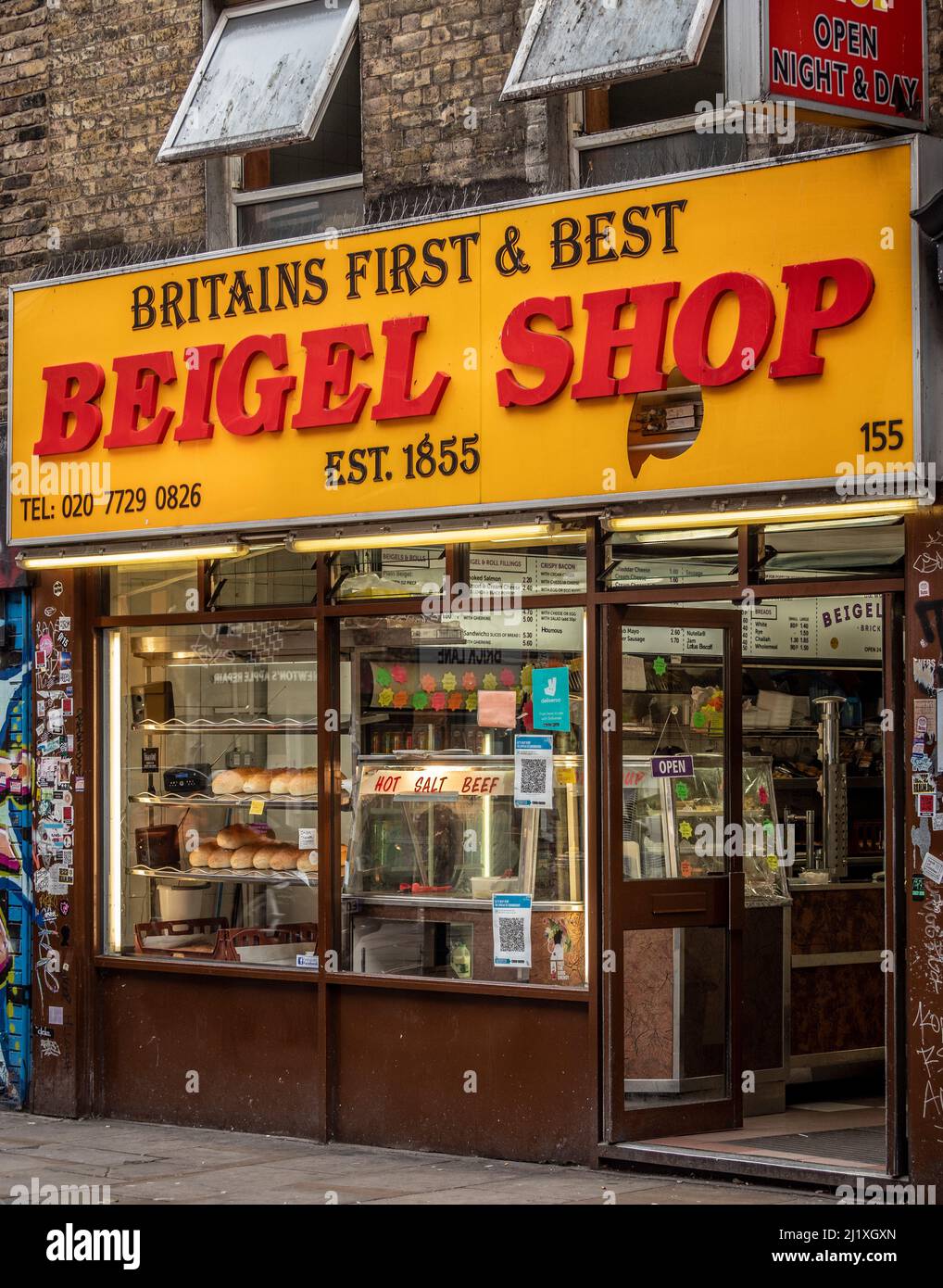 Britain's first and best Beigel Shop exterior facade with yellow and red sign in Brick Lane. London. UK Stock Photo