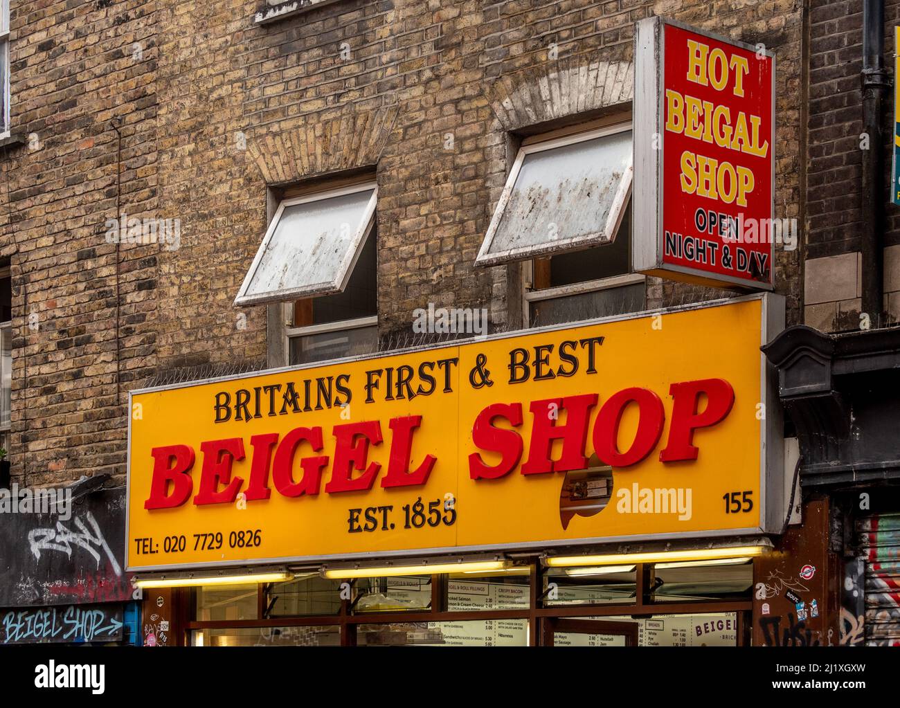 Britain's first and best Beigel Shop exterior yellow and red sign in Brick Lane. London. UK Stock Photo
