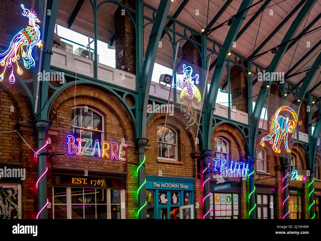 Neon light art installation by Chila Burman in the market hall at Covent Garden, London. Stock Photo