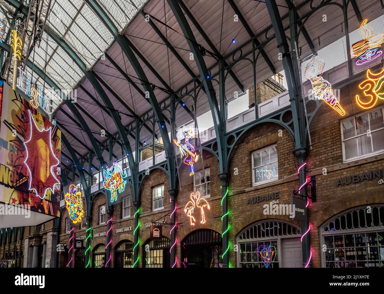 Neon light art installation by Chila Burman in the market hall at Covent Garden, London. Stock Photo