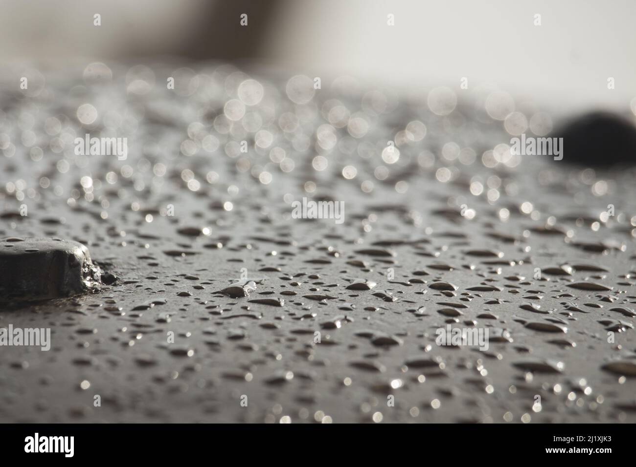 The rain water falling on the iron bar has created such a scene Stock