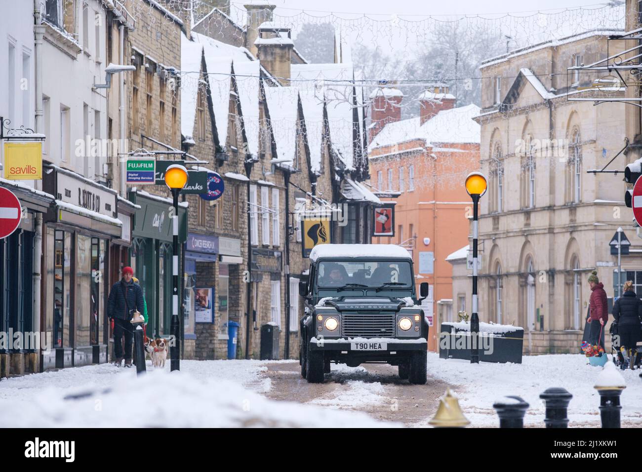 the centre of cirencester town in a heavy winter snowfall. Stock Photo