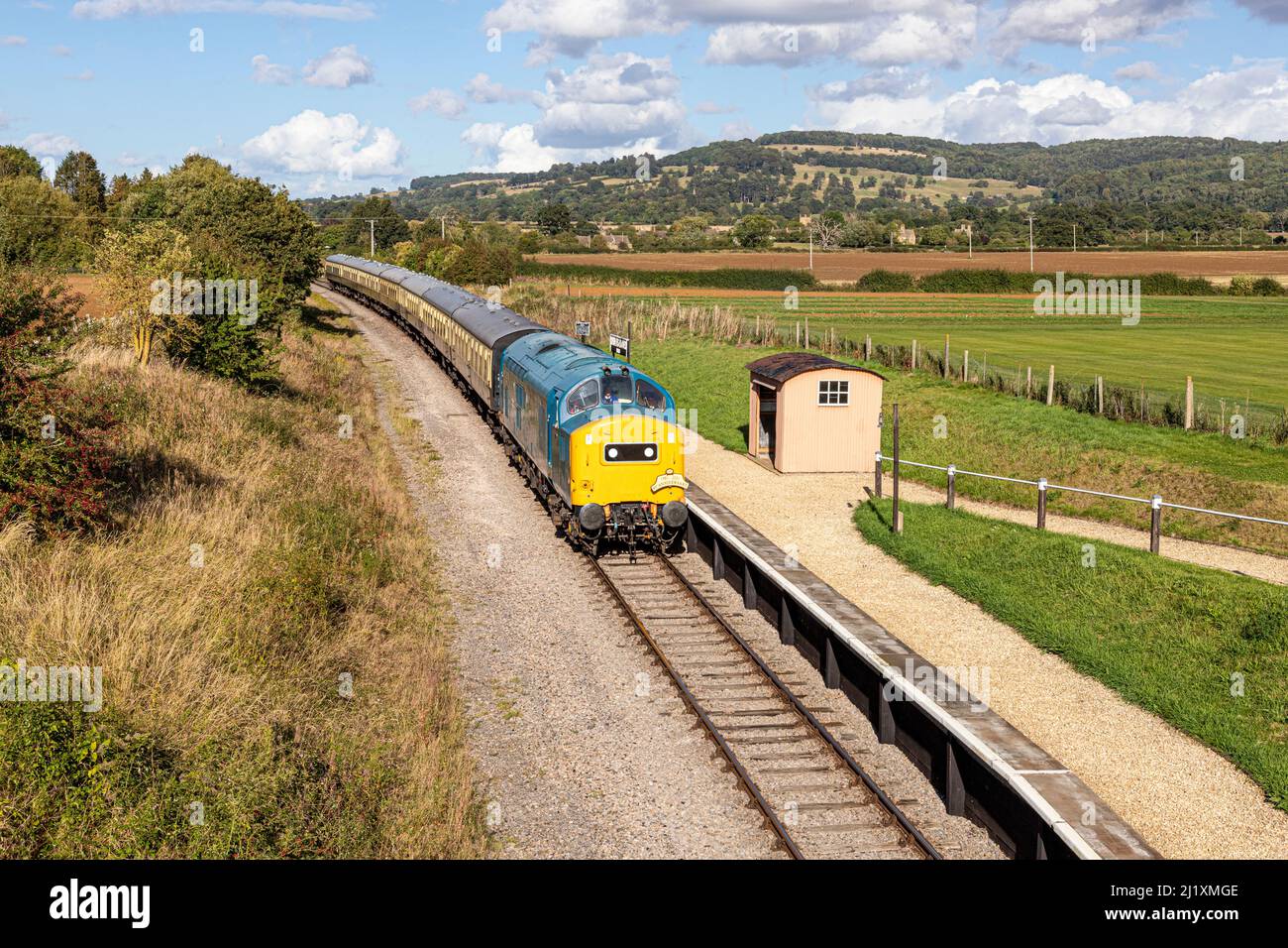 Diesel Electric Locomotive on the Gloucestershire Warwickshire Steam Railway passing Hayles Abbey Halt near the Cotswold village of Hailes, Glos. UK Stock Photo