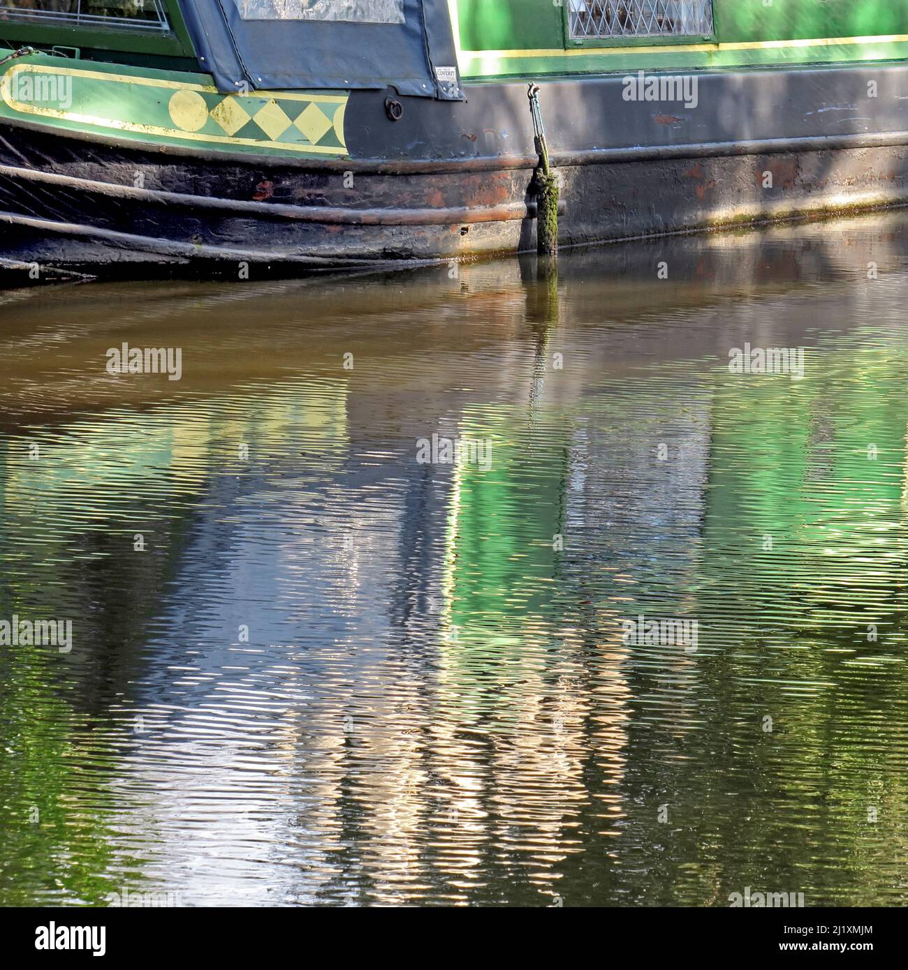 Photograph Trent and Mersey canal a British Waterways canal near  Tixall in Staffordshire showing a light forms of nature mirrored on the surface of w Stock Photo