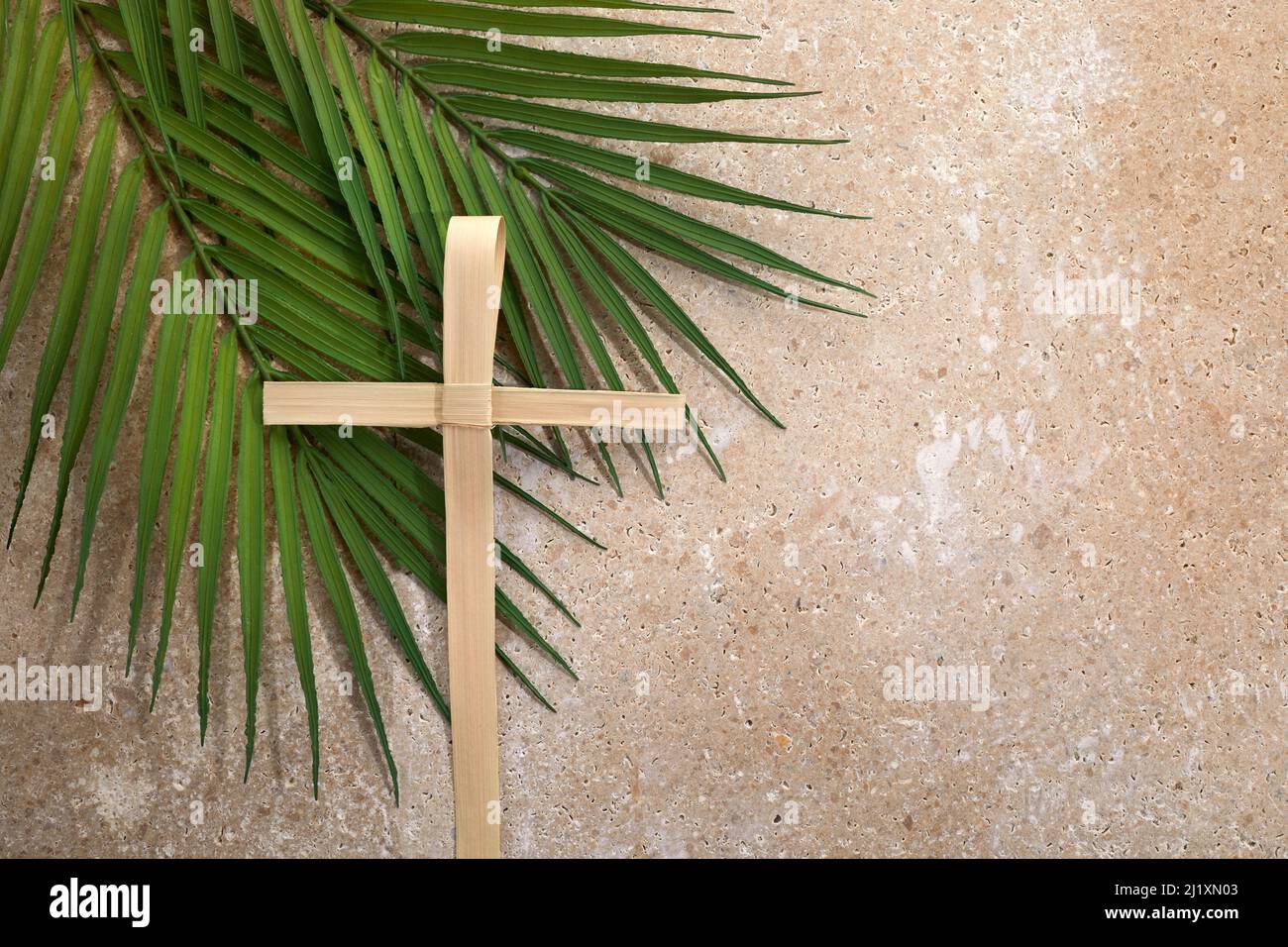 Palm cross and palm leaves. Palm sunday and easter day concept Stock