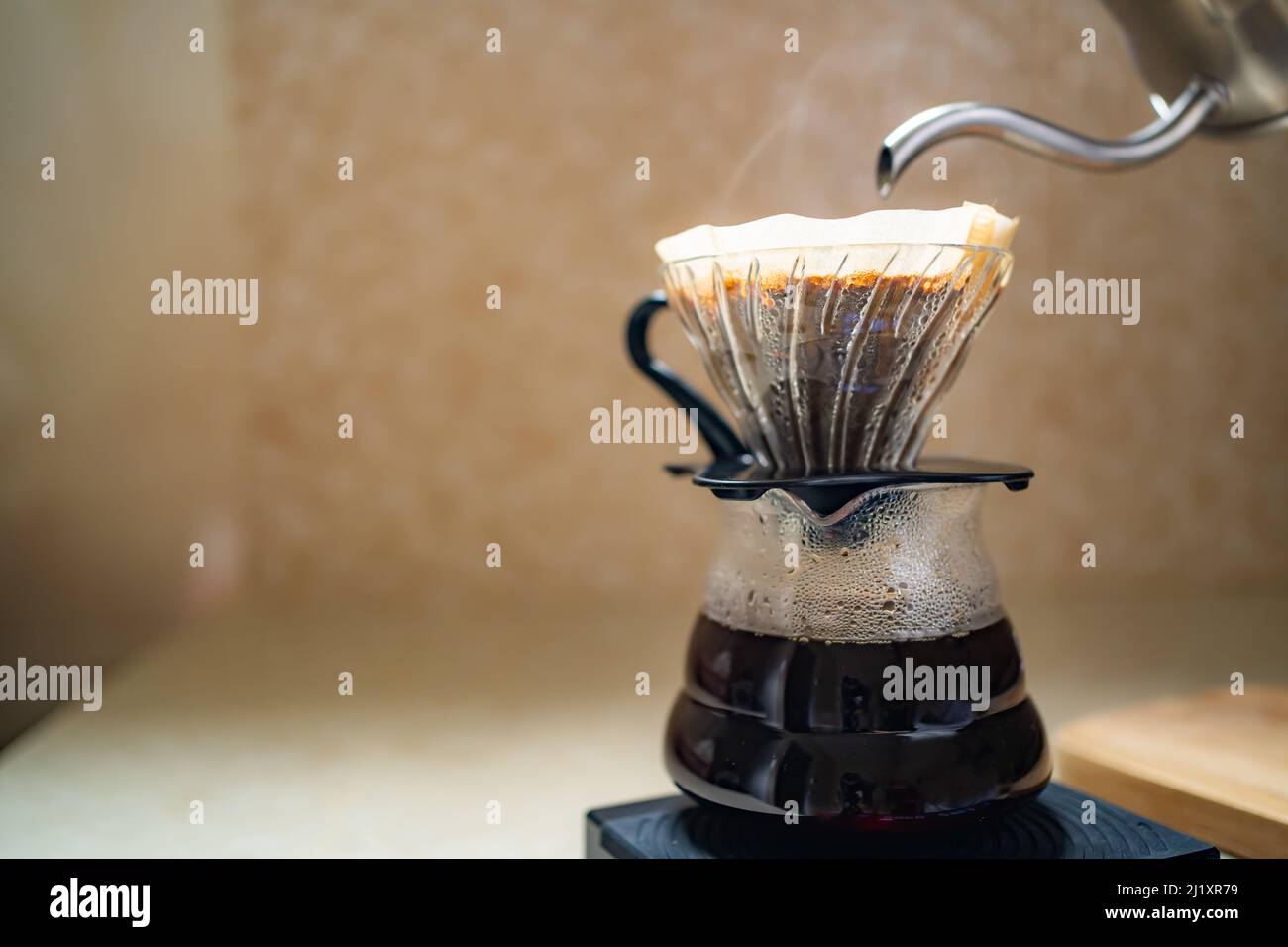 Making pour over coffee with dripper and carafe Stock Photo