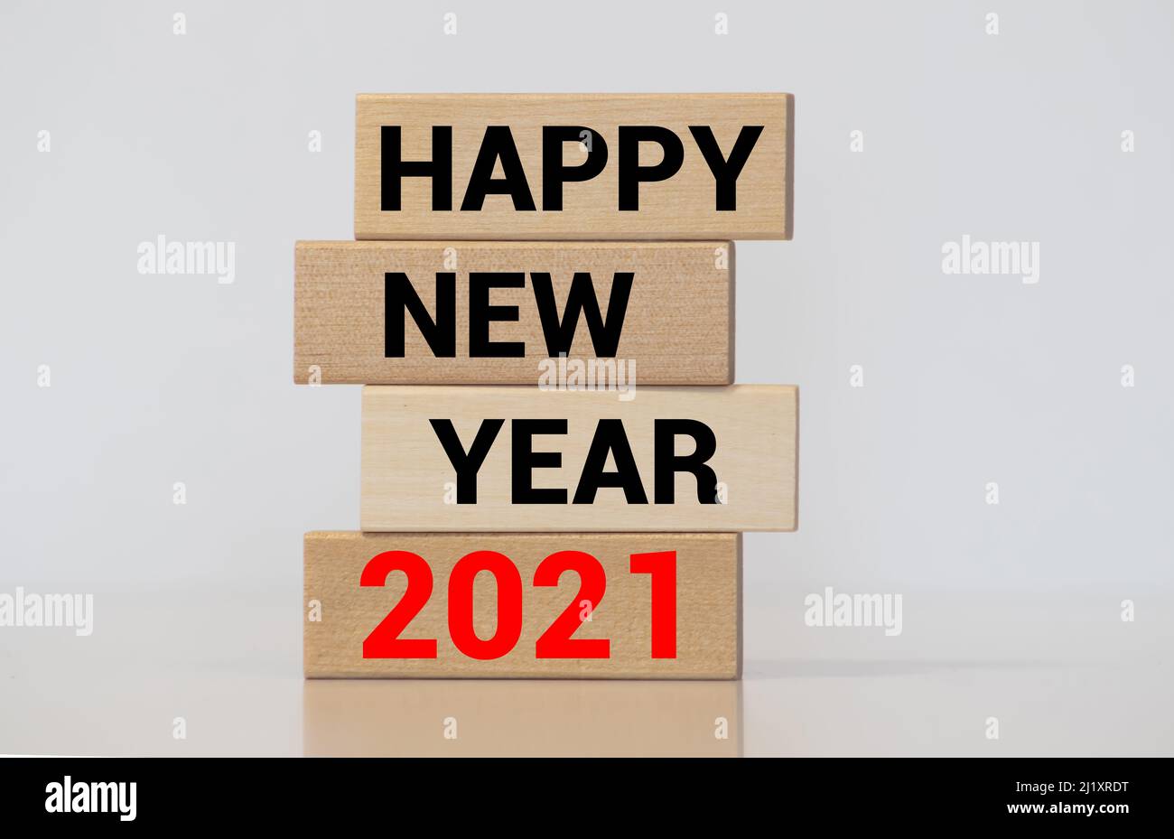 Word HAPPY NEW YEAR 2021 made from wooden cubes with decoration for Chistmas. Banner, backdrop Stock Photo
