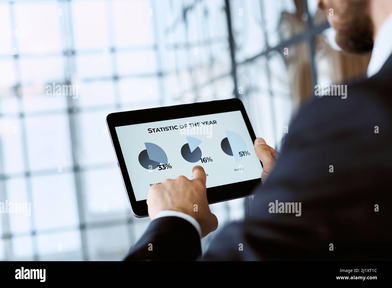 business man analyzing the annual data on cryptocurrency. Stock Photo