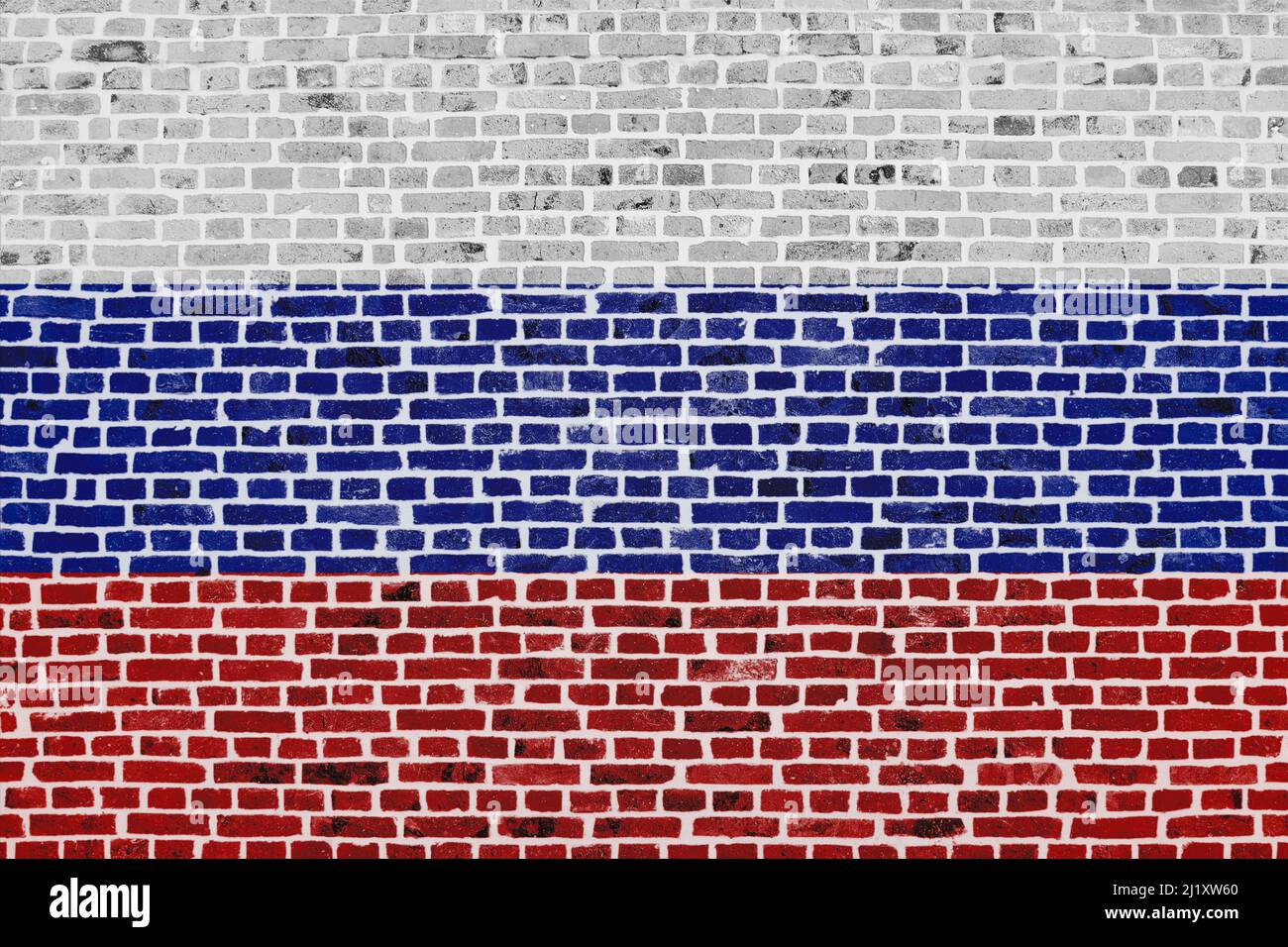 Close-up on a brick wall with the flag of Russia painted on it. Stock Photo