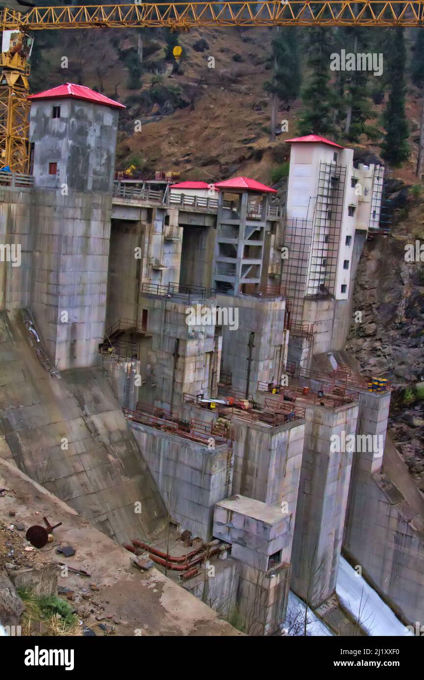 Indian hydropower, Construction of giant hydroelectric dam on Parvati river, hundreds of meters dam, discharge of water through locks of turbine. Hima Stock Photo