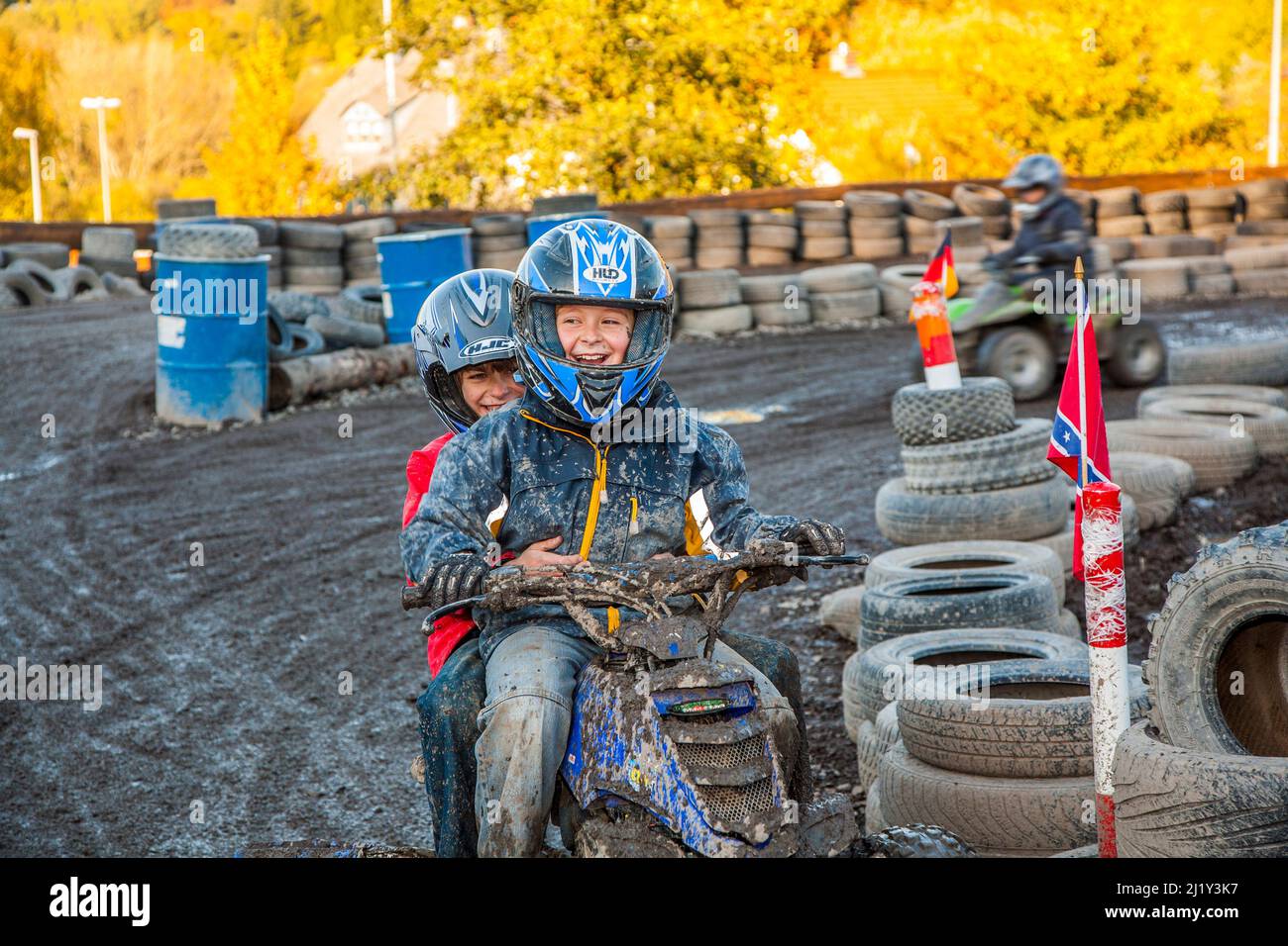 Schmitten, Germany - October 19, 2009: children love to race with a quad at the muddy quad track. Stock Photo