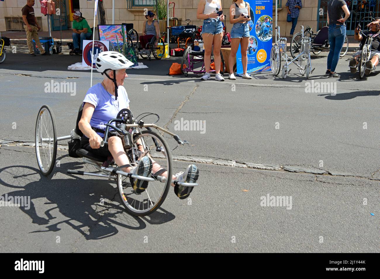Disabled woman using a hand-powered tricycle at Cyclovia Sunday in downtown Tucson when parts of the city streets are closed to vehicles except bicycl Stock Photo