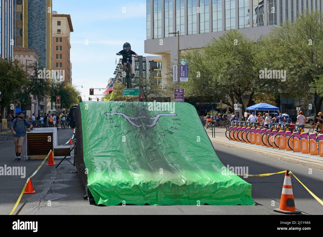 Young children performing BMX stunts at Cyclovia Sunday event in downtown Tucson Stock Photo