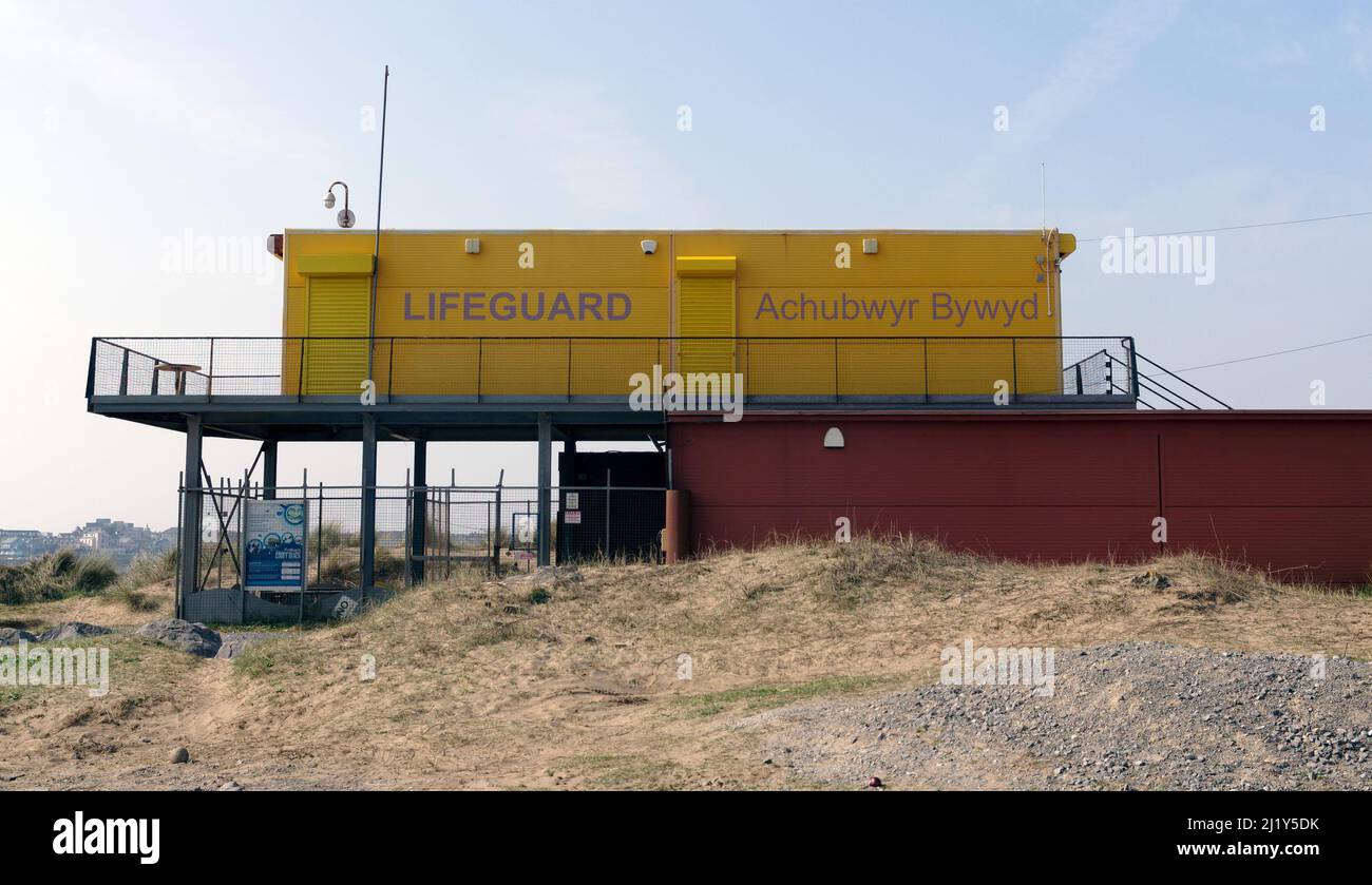 Large yellow lifeguard station near Porthcawl, South Wales Stock Photo