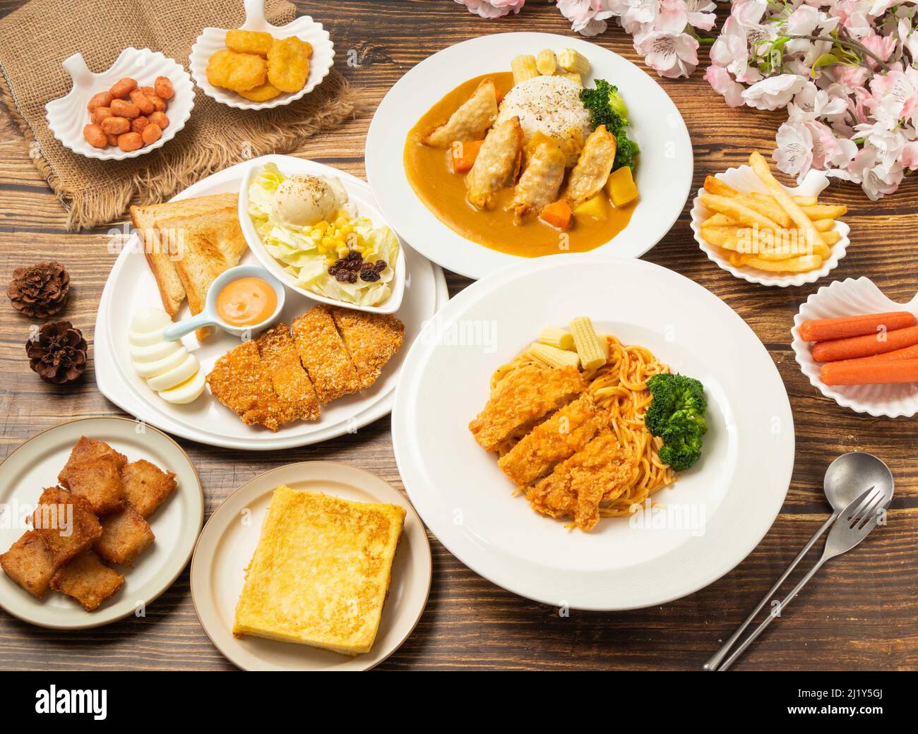 Assorted food French Toast, Fried small bean, chicken thighs, pasta spaghetti, hot dogs, Fried