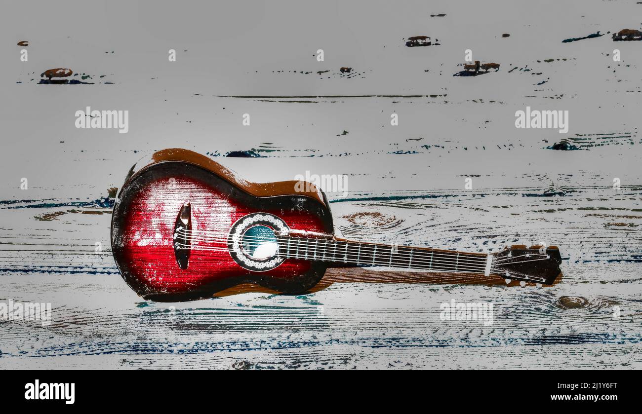 a red guitar on a gray background Stock Photo