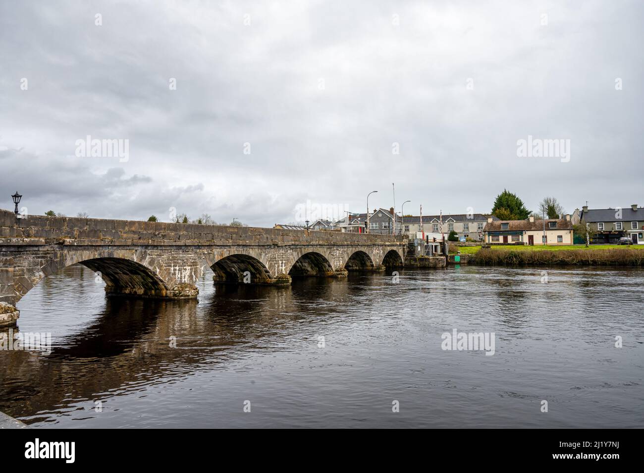 Rooskey, Ireland: March 17, 2022: Rooskey stone bridge over the River Shannon in Ireland Stock Photo