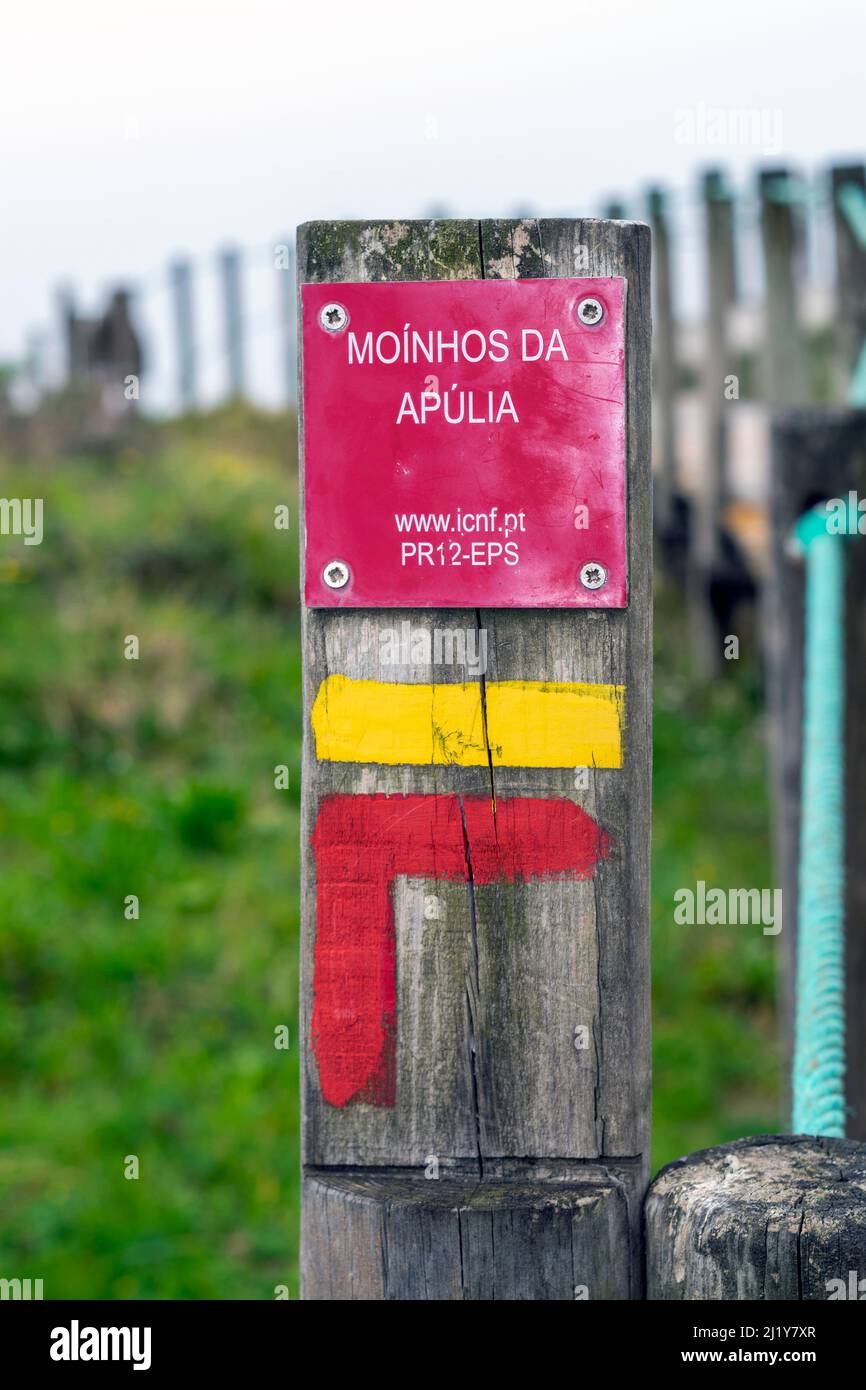 Hiking in Portugal on northwest coast in Apúlia beach near to windmills, tourism accommodation on windmills. Windmills near the ocean. Hiking signs. Stock Photo