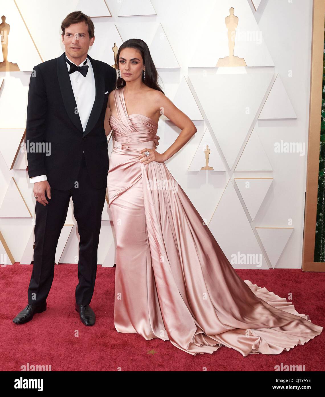 Ashton Kutcher and Mila Kunis arriving on the red carpet of the 94th Oscars at the Dolby Theatre at Ovation Hollywood in Los Angeles, CA, on Sunday, March 27, 2022. © A.M.P.A.S / AFF-USA.COM Credit: AFF/Alamy Live News Stock Photo