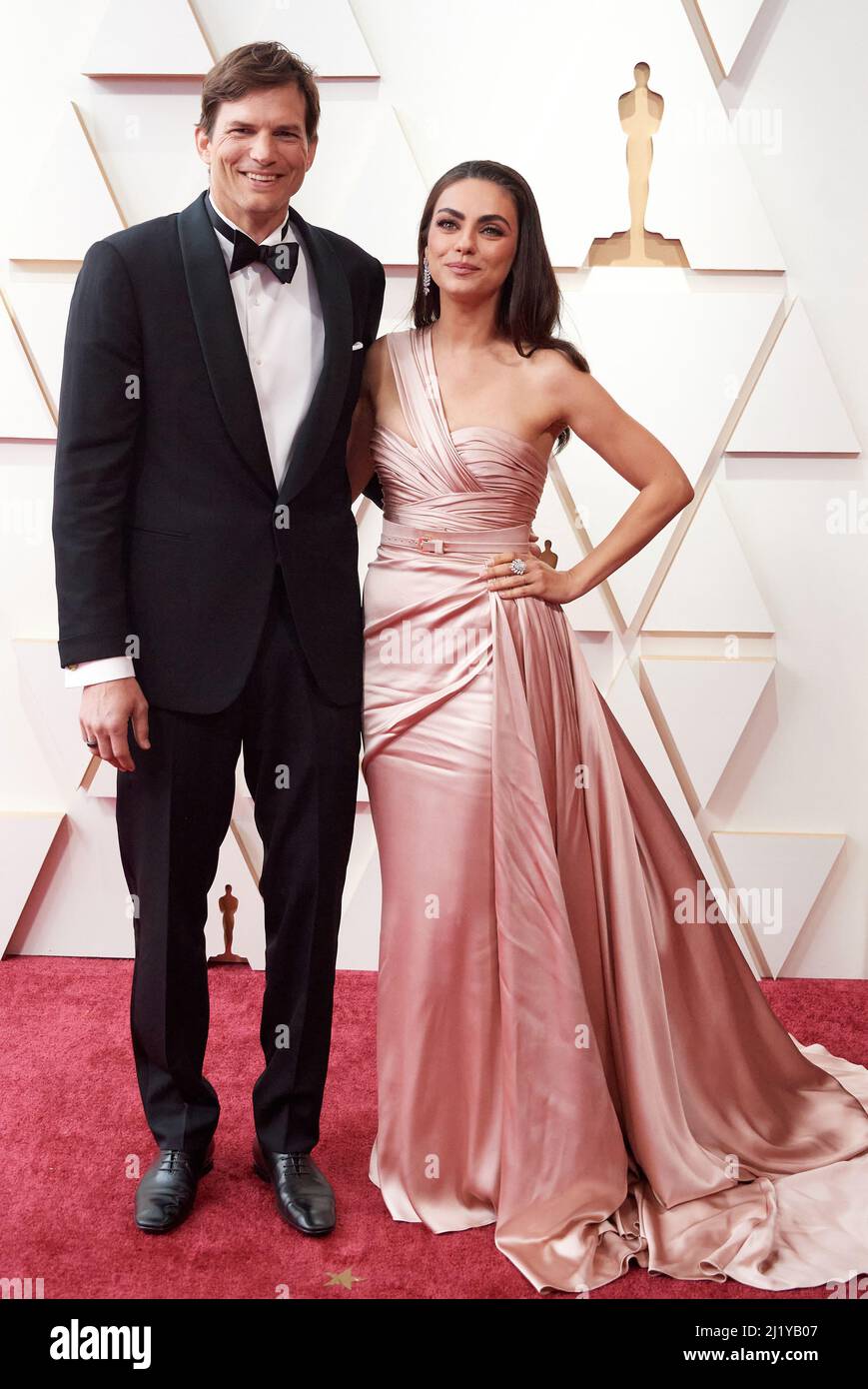 Ashton Kutcher and Mila Kunis arriving on the red carpet of the 94th Oscars at the Dolby Theatre at Ovation Hollywood in Los Angeles, CA, on Sunday, March 27, 2022. © A.M.P.A.S / AFF-USA.COM Credit: AFF/Alamy Live News Stock Photo