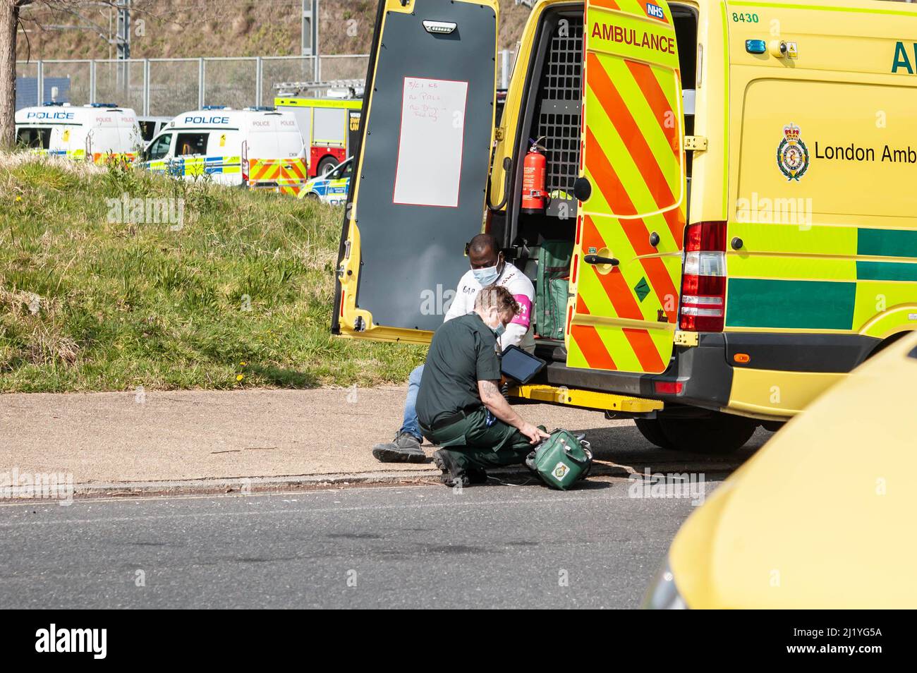 LONDON, ENGLAND 23 March 2022 Man being treated by a paramedic following a chlorine gas leak