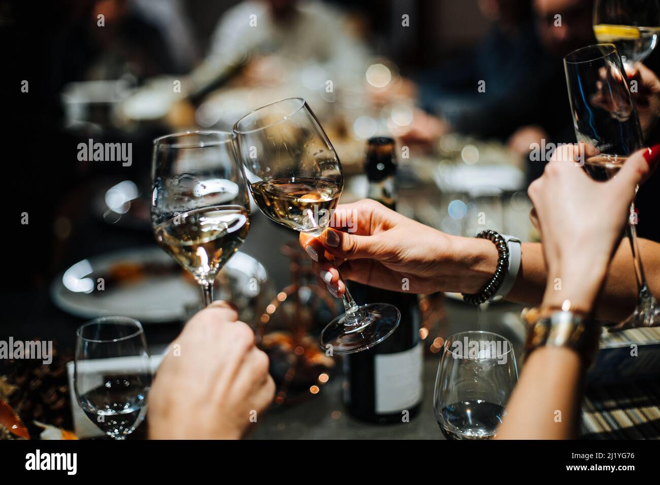 Champagne Glasses And Glasses Of Wine In Hands Of People At Party People Clinking Glasses With