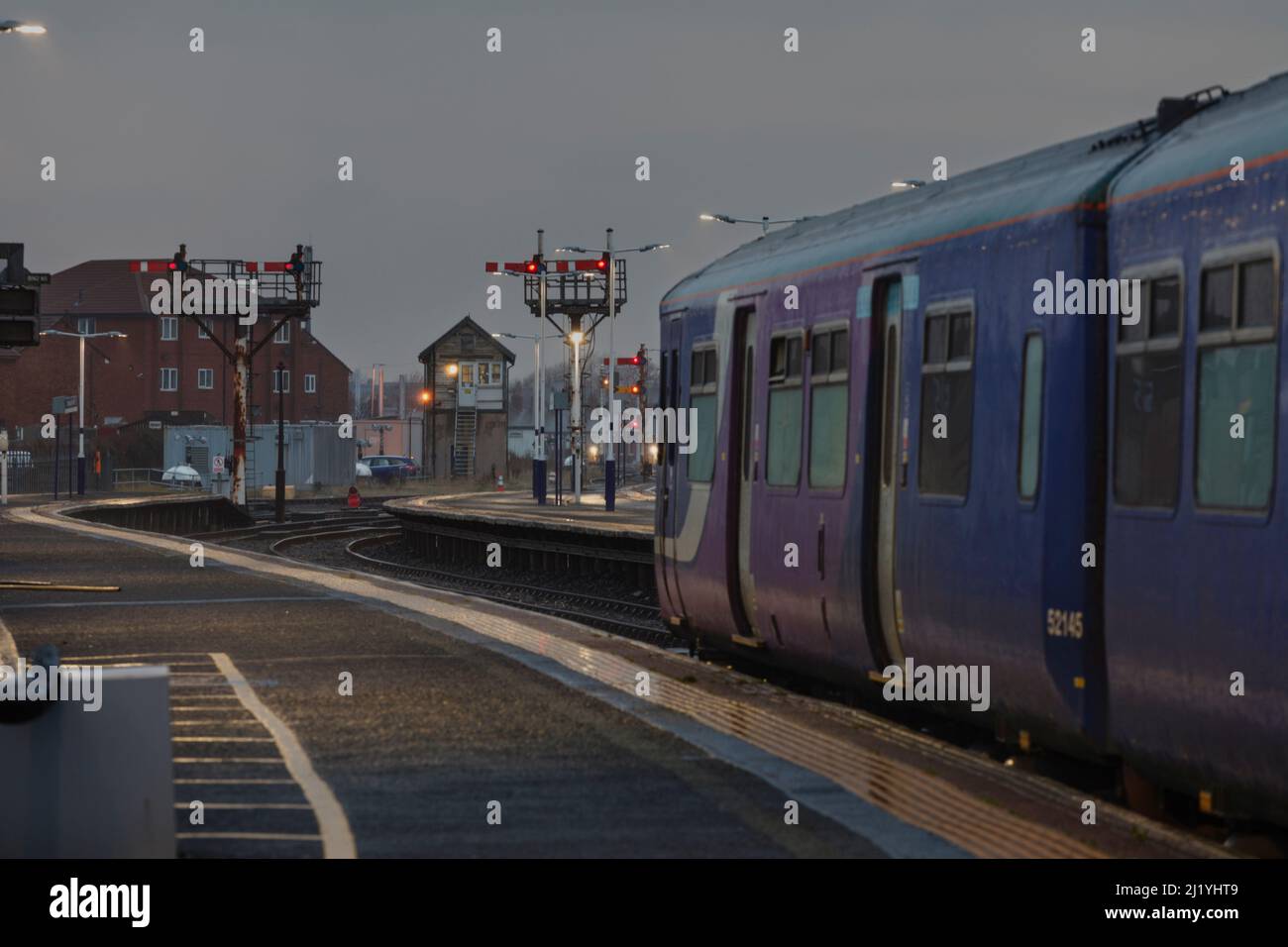 Northern Rail class 150 sprinter trainat Blackpool North railway station with the mechanical semaphore bracket signals and number 2 signal box Stock Photo