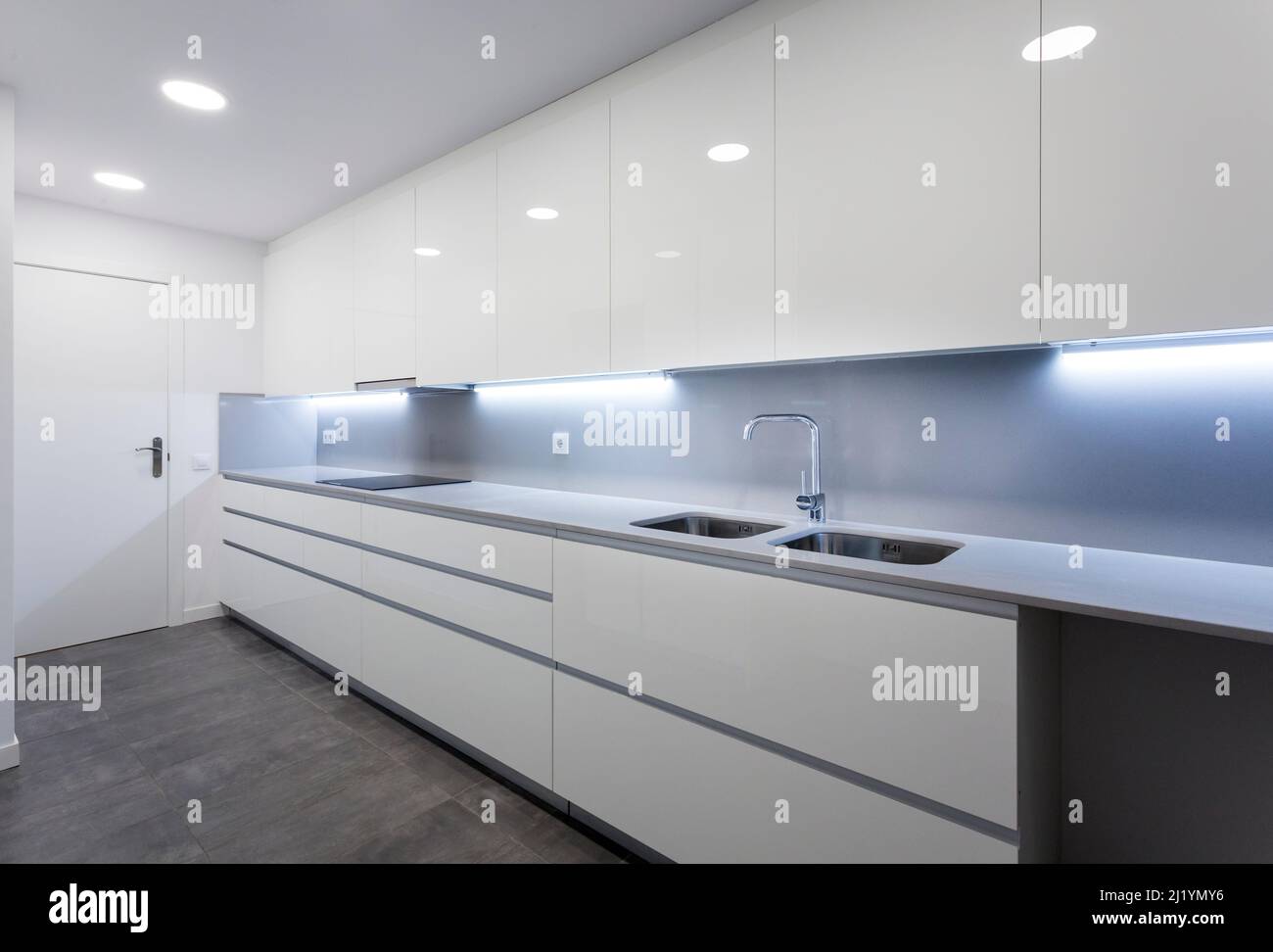 Large white kitchen with plain cabinets Stock Photo - Alamy