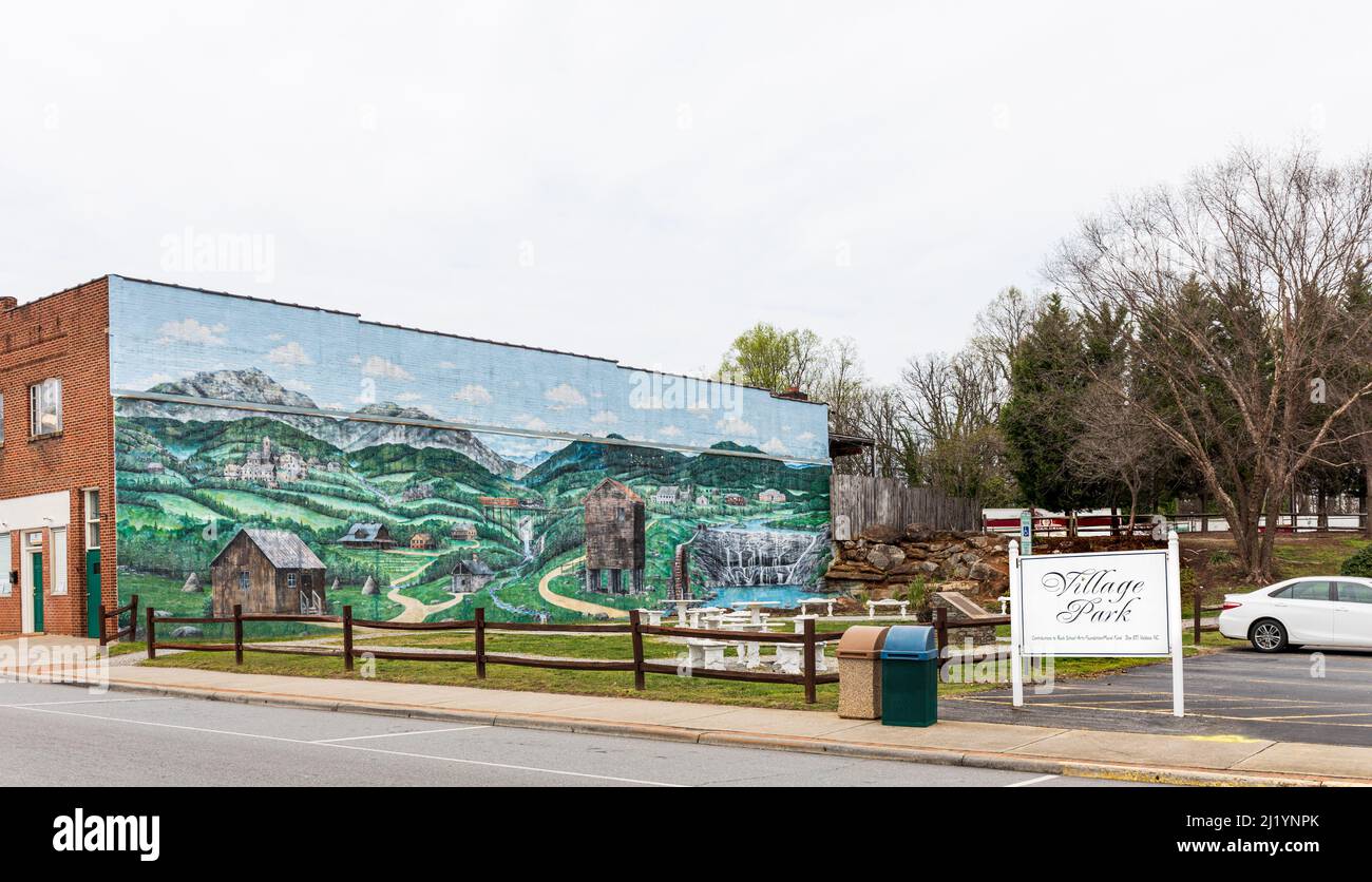 VALDESE, NC, USA-24 MARCH 2022: Village Park, showing a colorful mural on side of building. Stock Photo