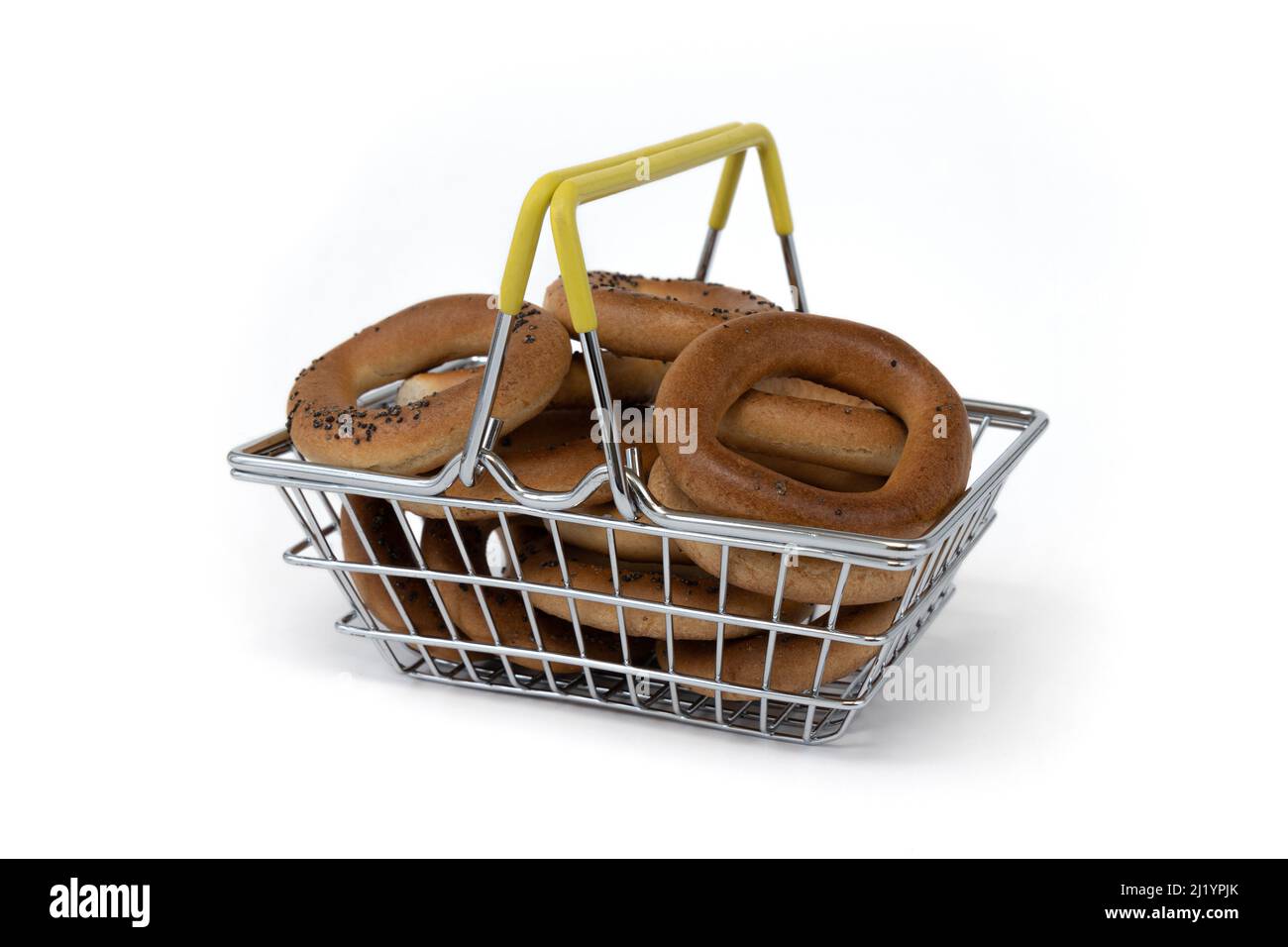 bagels with poppy in basket isolated on white background, side view, food market bakery concept Stock Photo