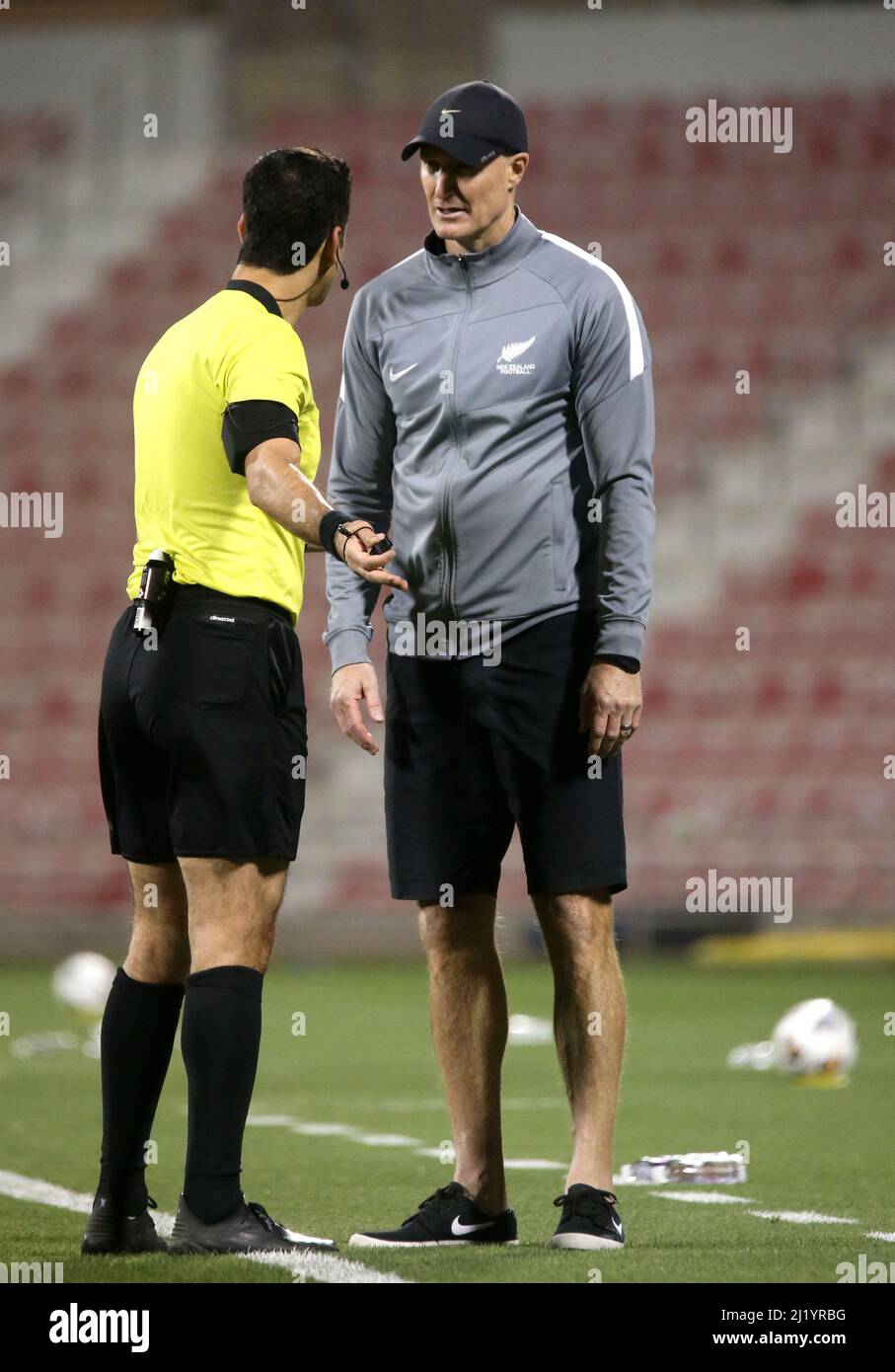 DOHA, QATAR - MARCH 27: Referee Abdulrahman Al Jassim of Qatar argues with Danny Hay head coach of New Zealand ,during the FIFA World Cup Qatar 2022 qualification match between New Zealand and Tahiti at Grand Hamad Stadium on March 27, 2022 in Doha, Qatar. (Photo by MB Media) Stock Photo