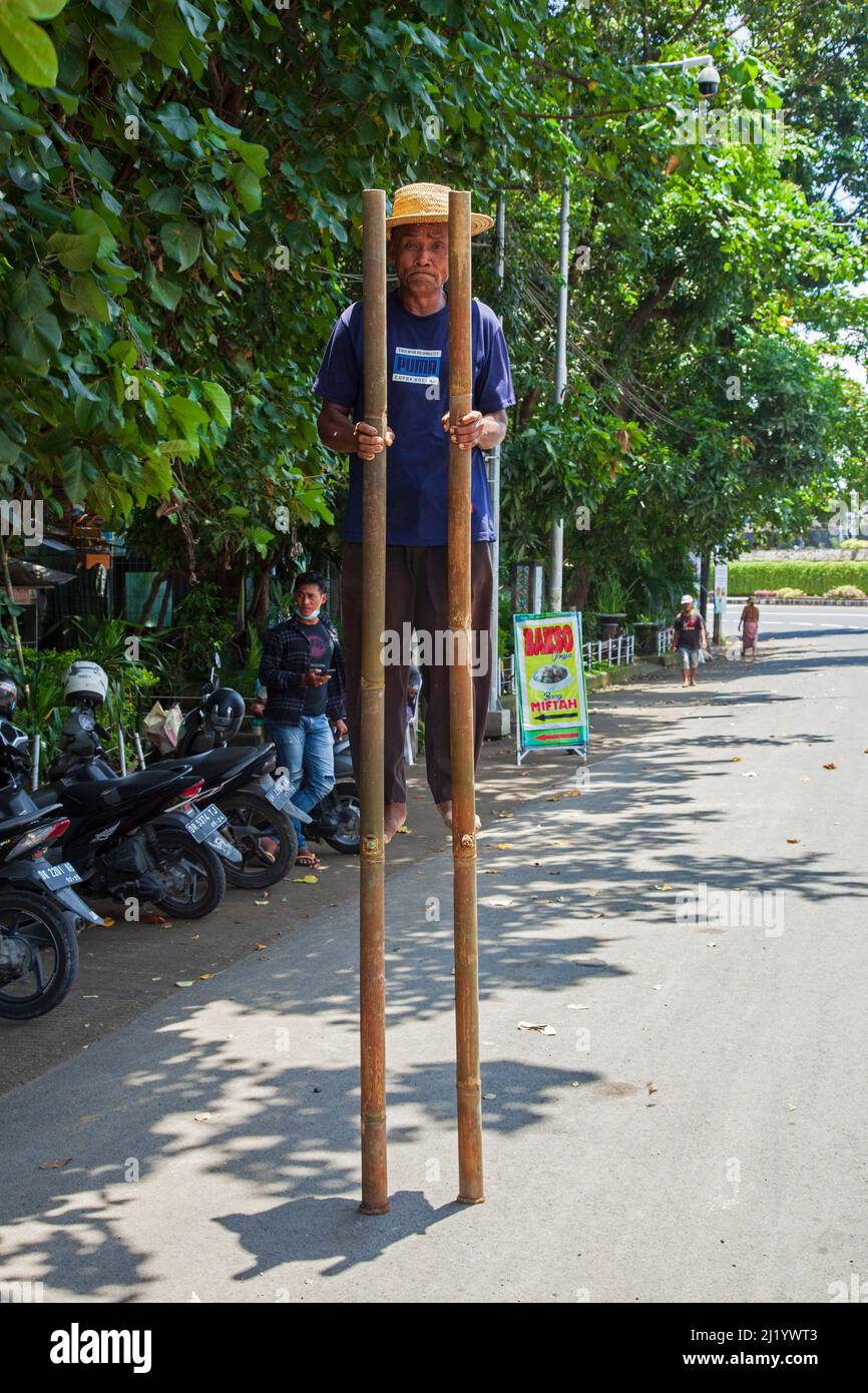 Walking with stilts hires stock photography and images Alamy