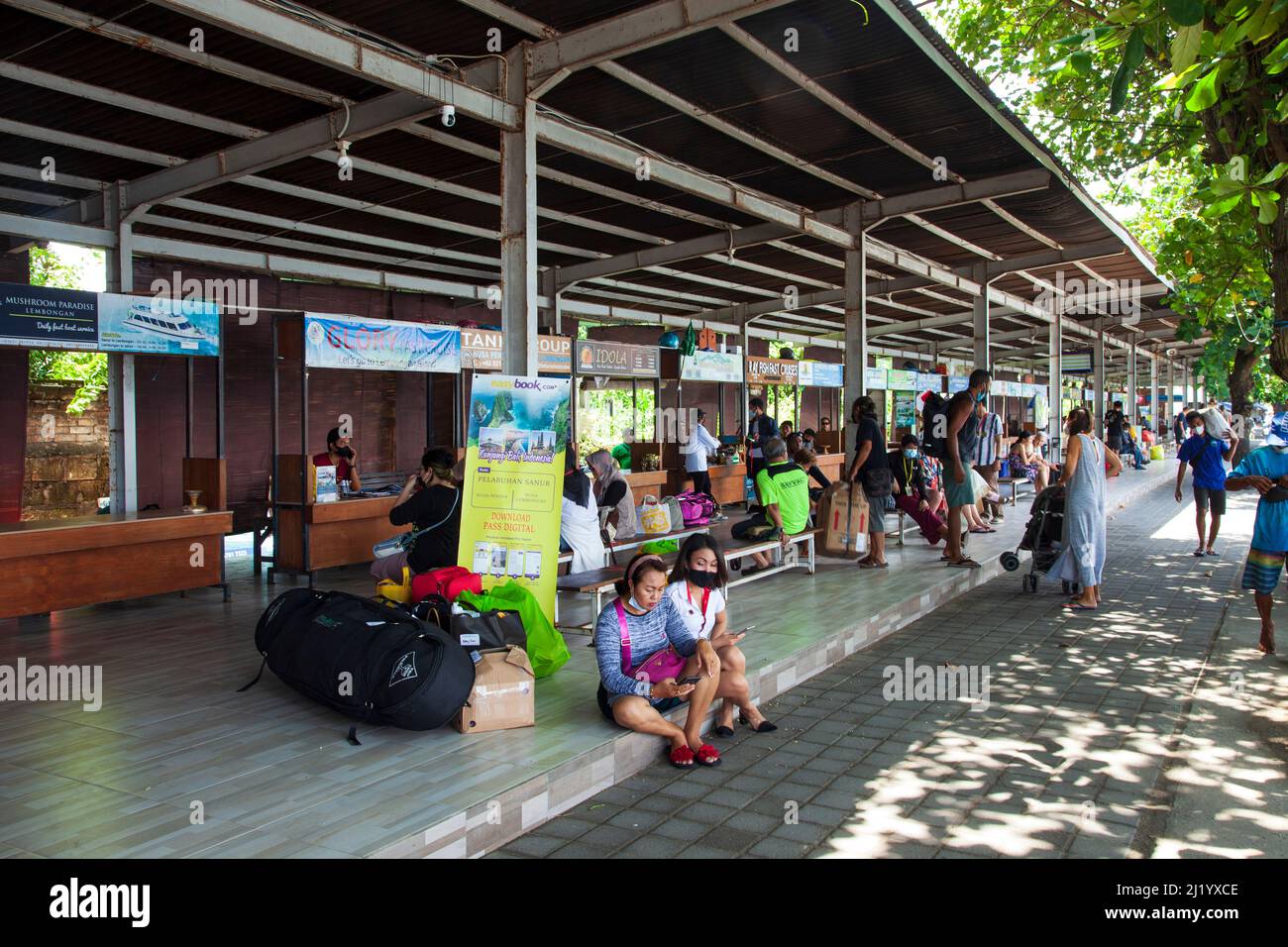 Sanur Ferry Ticket Counter in north Sanur, Bali. Passengers buying boat and ferry tickets to travel to places like Nusa Penida. Stock Photo