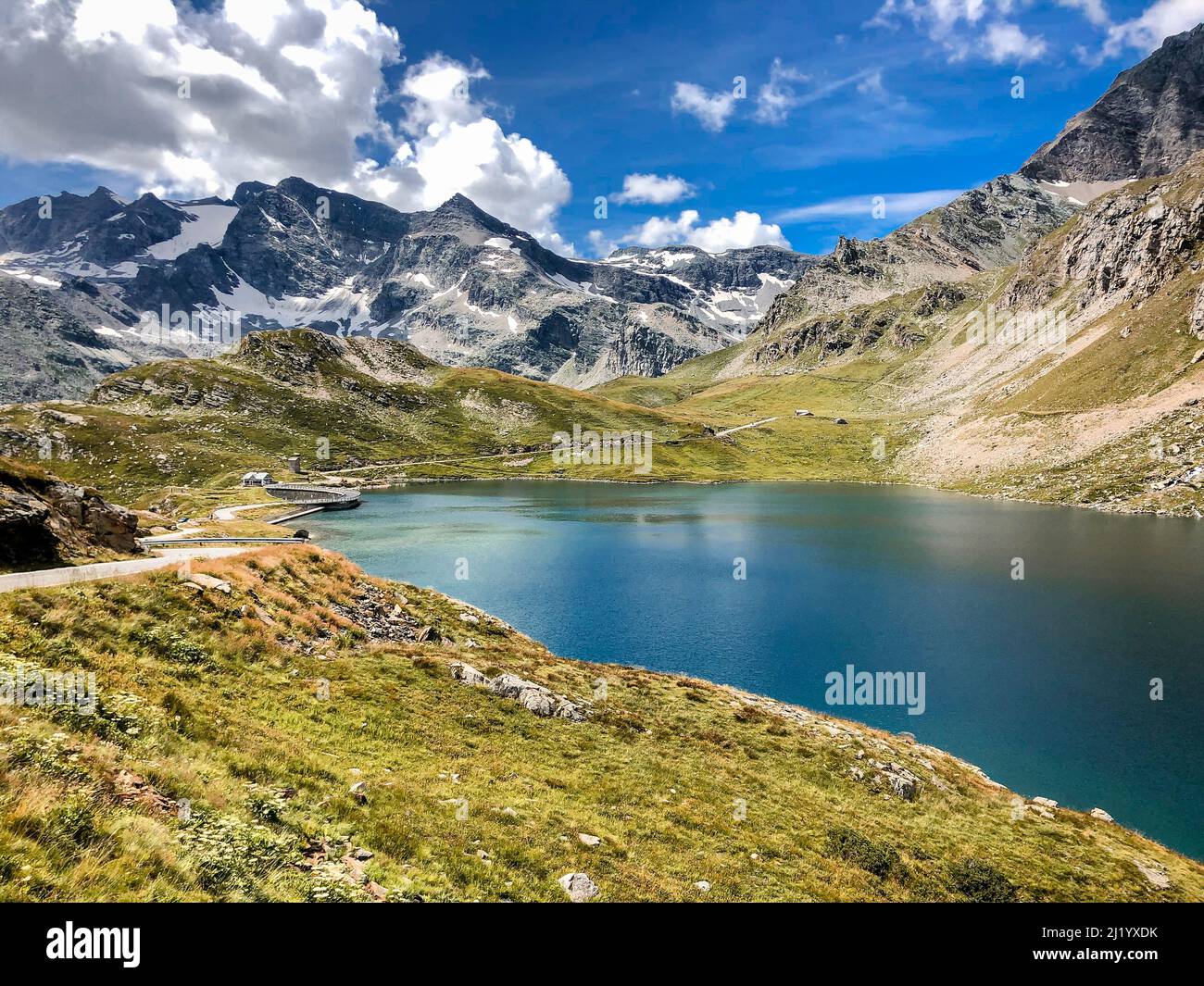 Agnel Lake is a lake at Ceresole Reale in the Province of Turin, Piedmont, Italy, near the Nivolet Pass. The reservoir on the Orco river Stock Photo