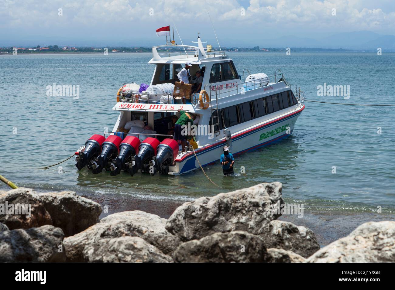 A fast boat with five large outboard engines at Sanur Port waiting to take  passengers to Nusa Penida island in Bali, Indonesia Stock Photo - Alamy